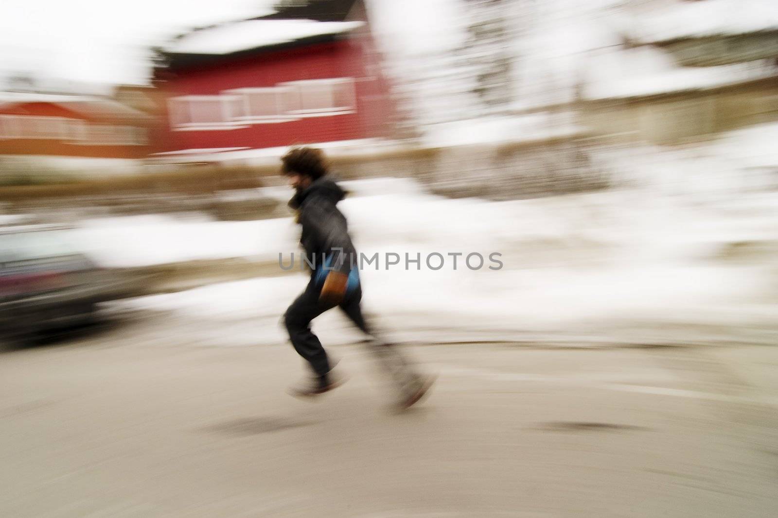 A motion blur abstract of a person walking in a hurry, a late or panic rushing concept image.