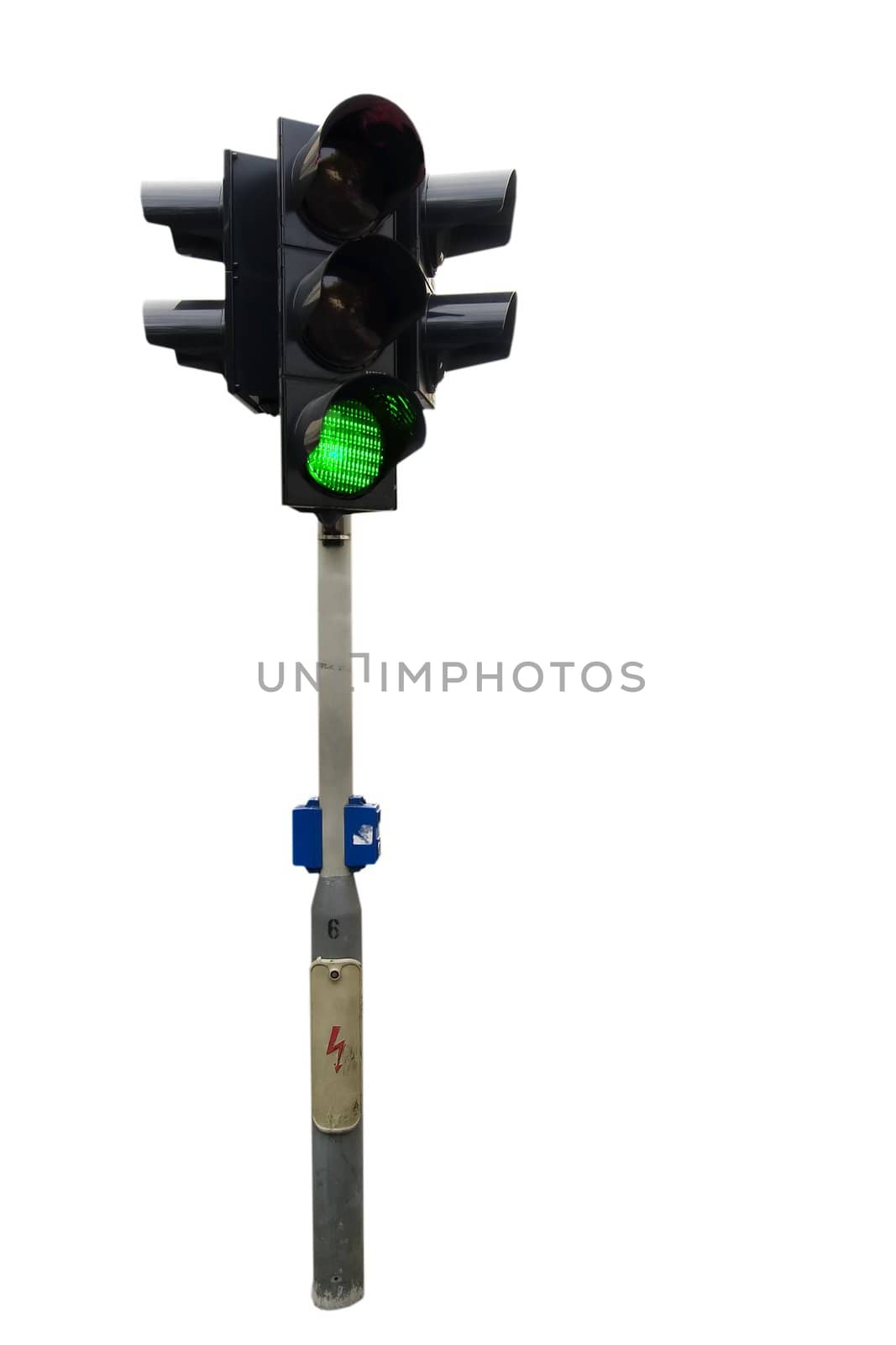 An isolated traffic light from Prague with the green light showing