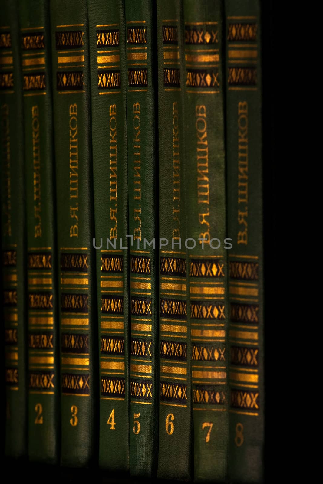 The green and gold book on the shelf by grigorenko