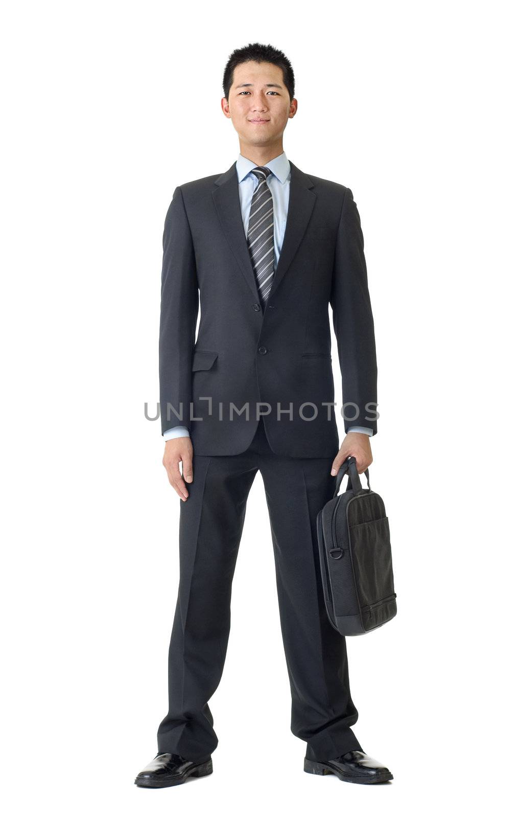 Full length portrait business man with briefcase isolated against white.