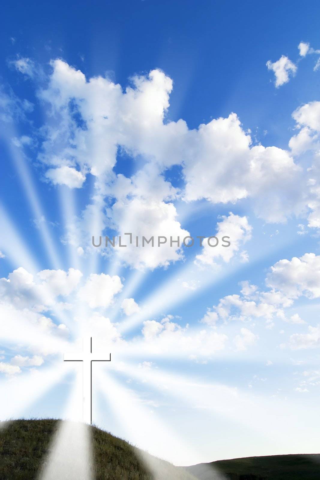 A glowing white cross on a hill.