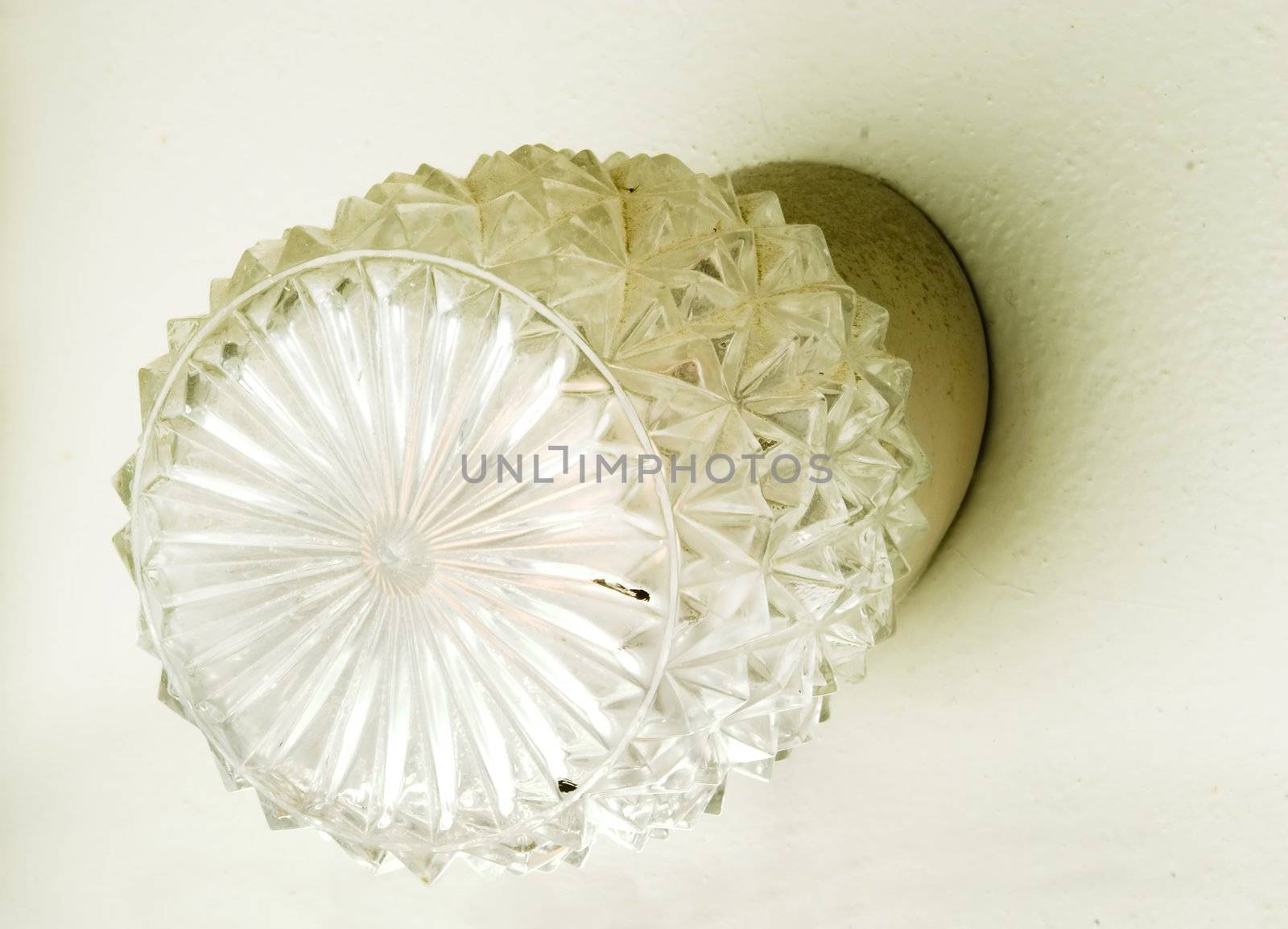 A retro wall lamp in an old bathroom