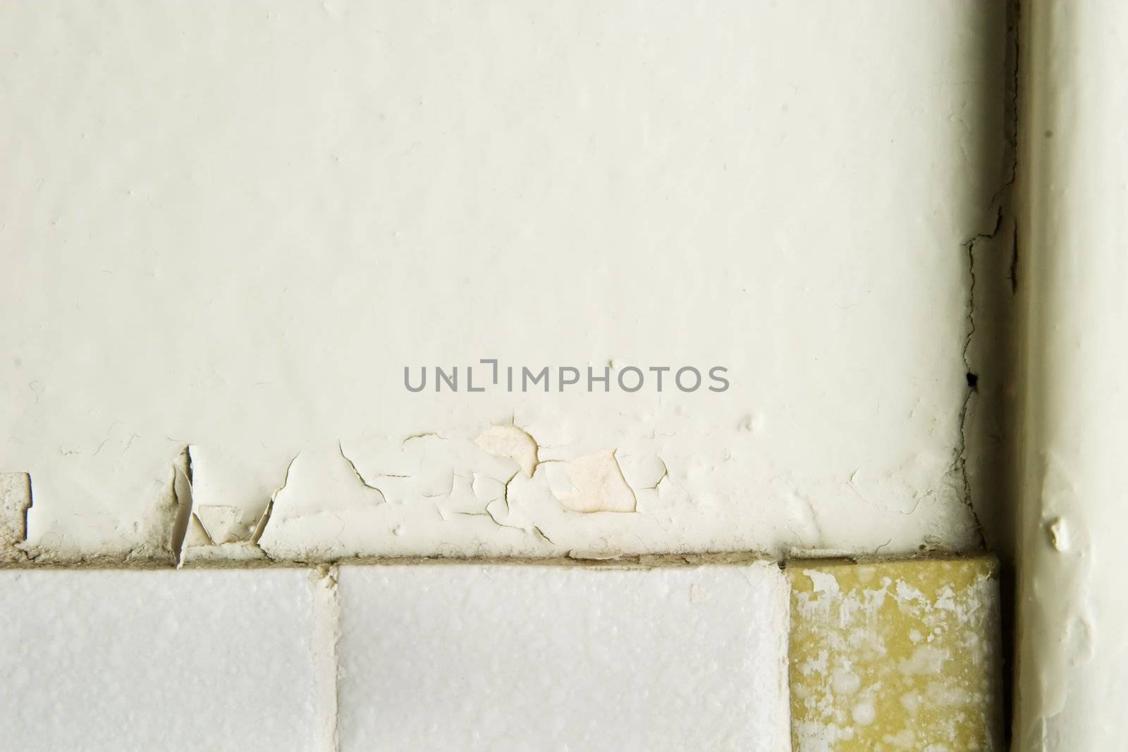 A retro 1970's bathroom wall abstract, with chipped paint and old tiles