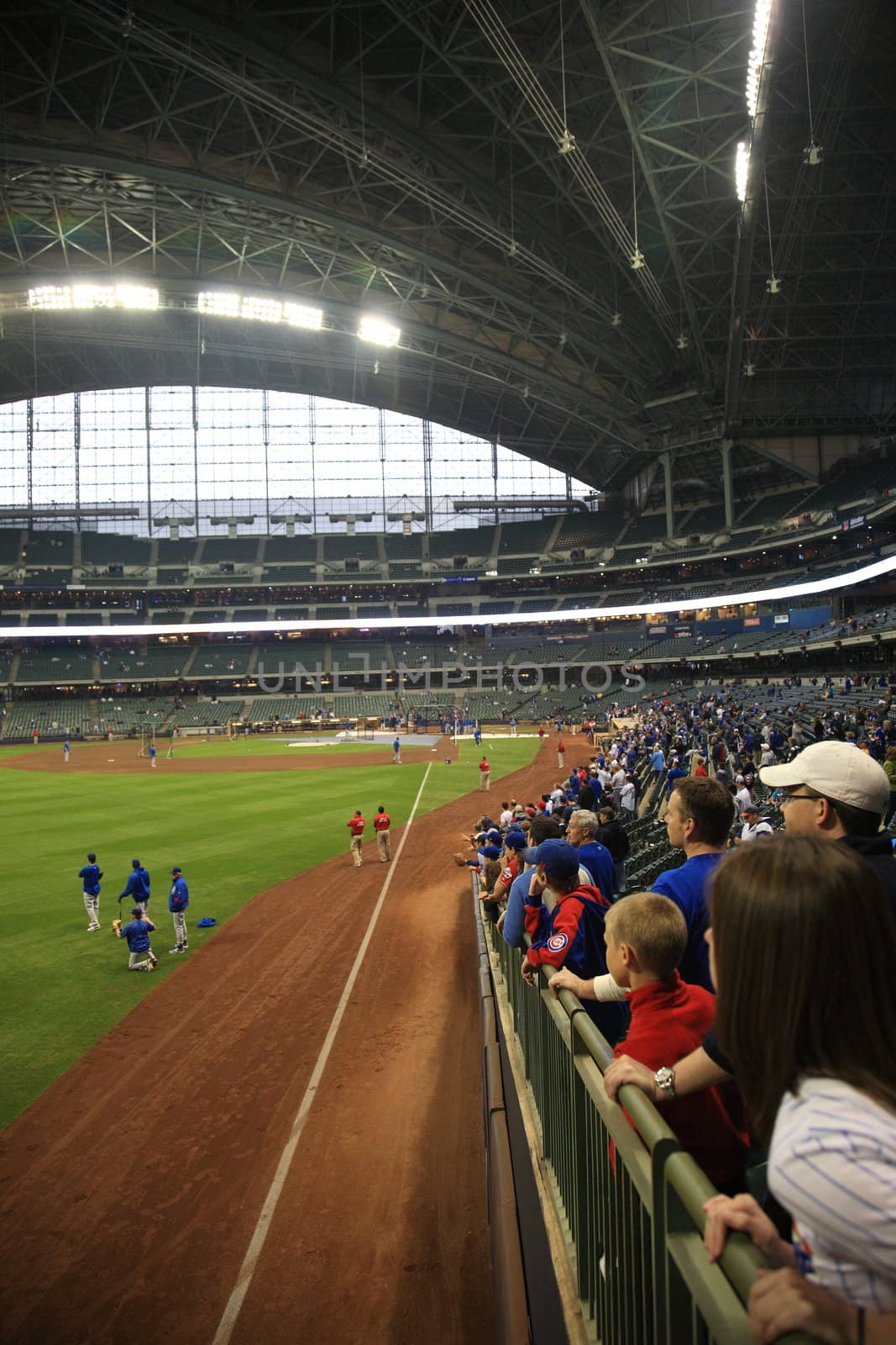 Brewers fans await a  baseball game against the Chicago Cubs under a closed dome