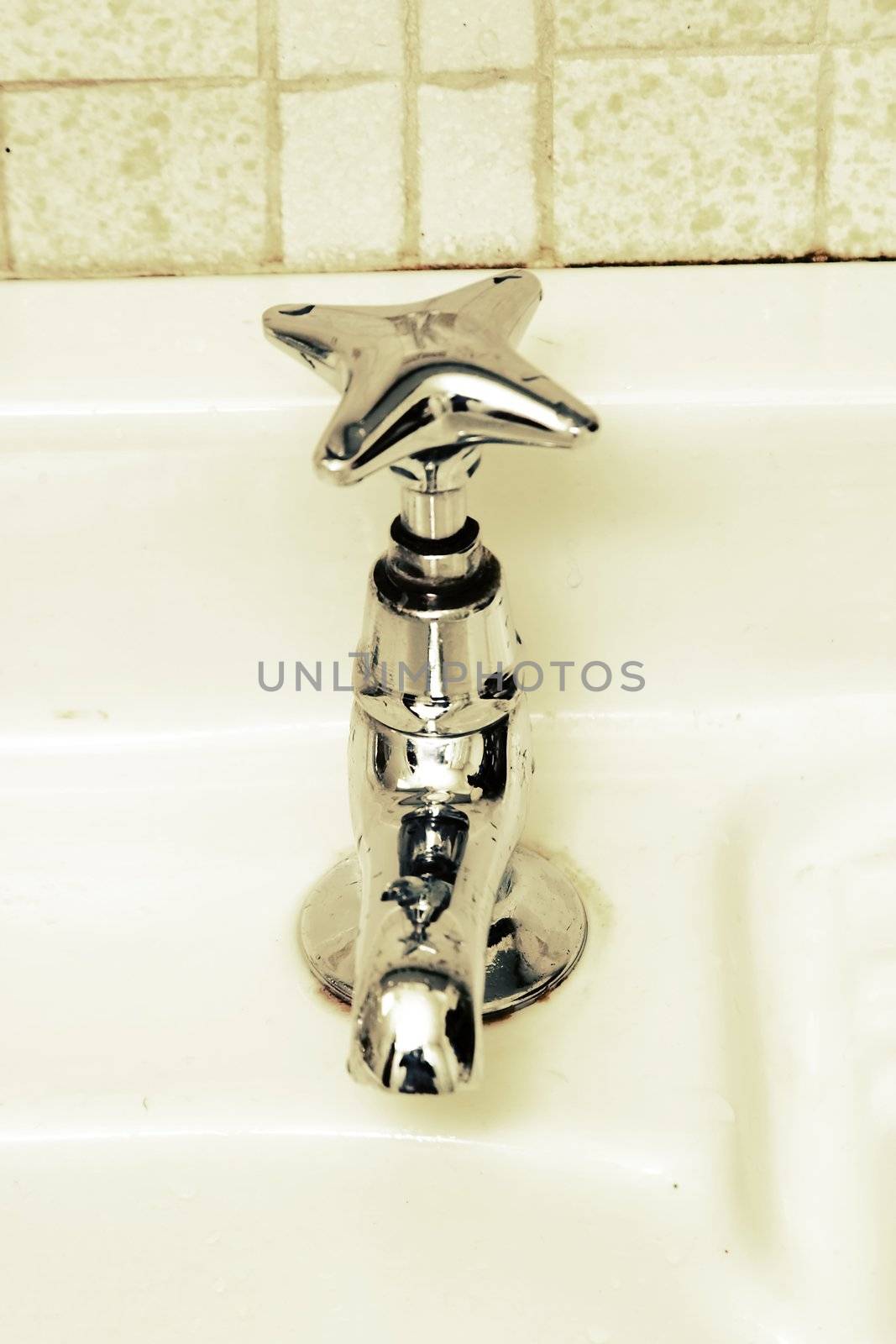 A retro bathroom sink tap.