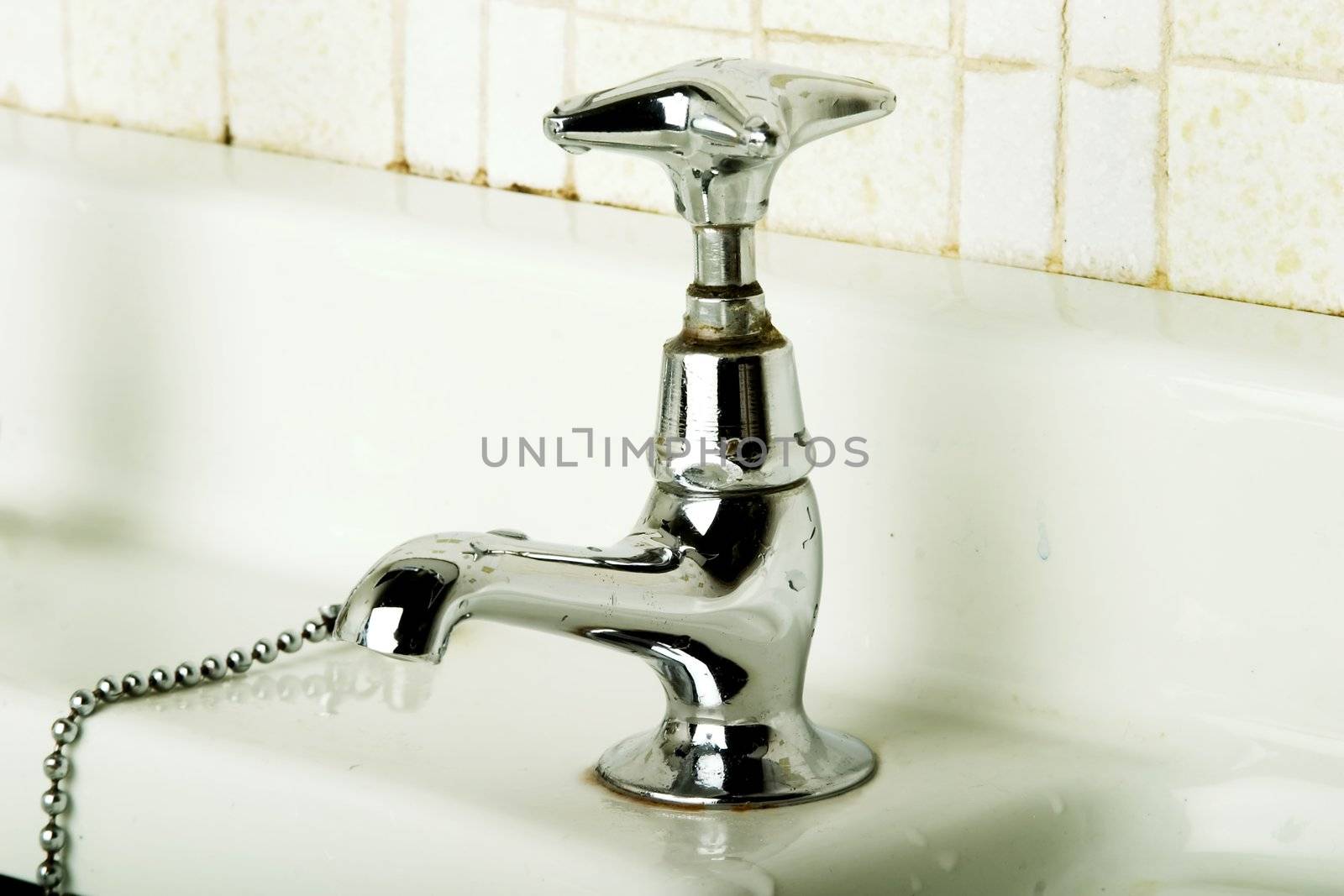 A retro bathroom sink tap.