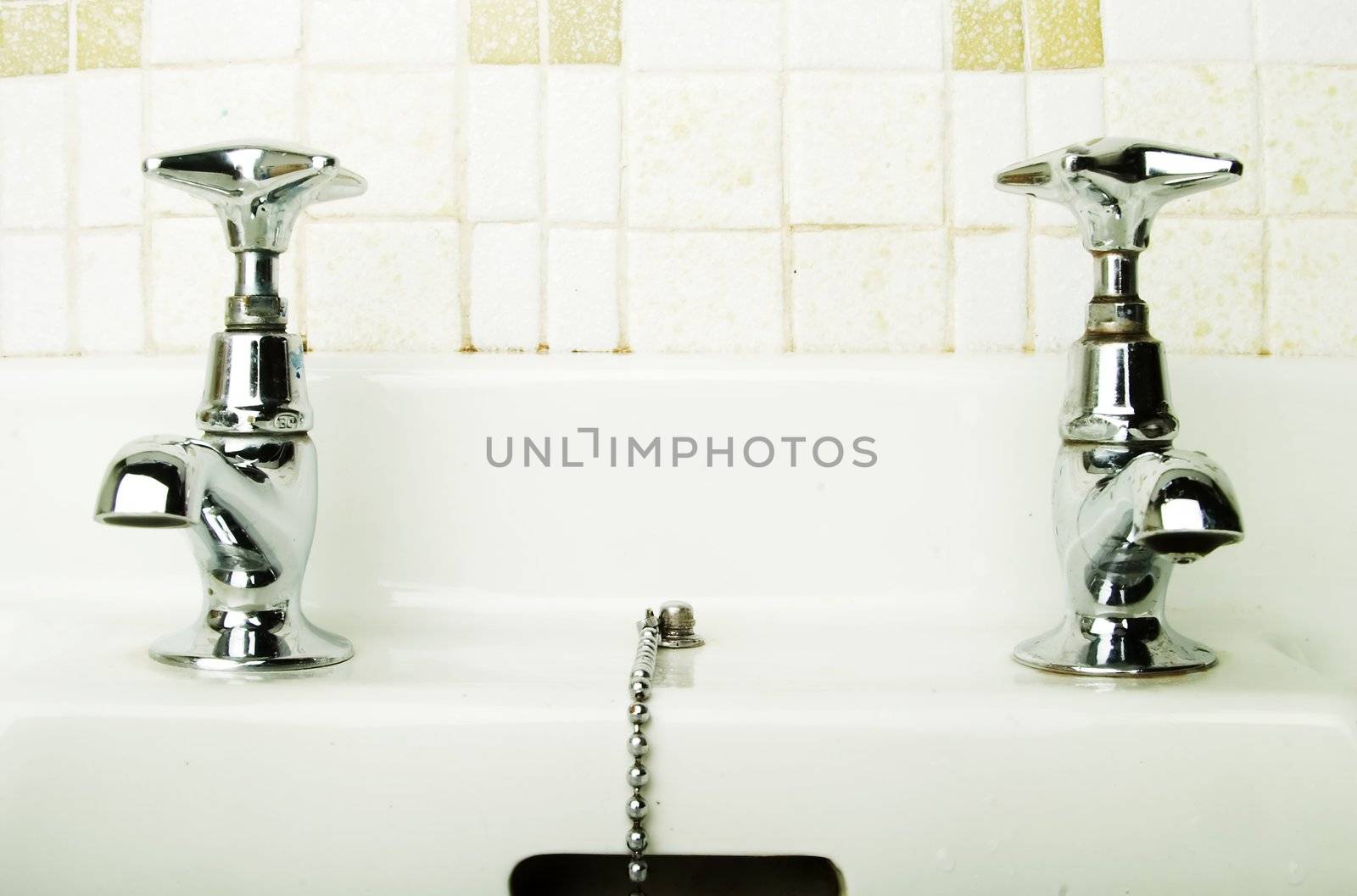 A retro bathroom sink tap.