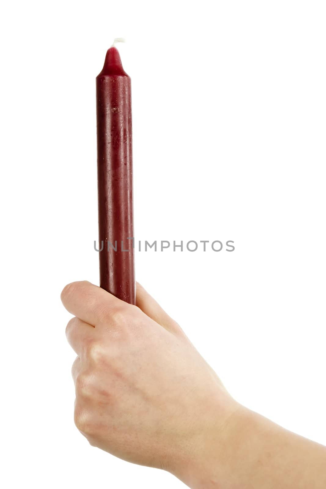 A female hand holding a purple candle with a grip fist.  Isolated on white with clip mask.