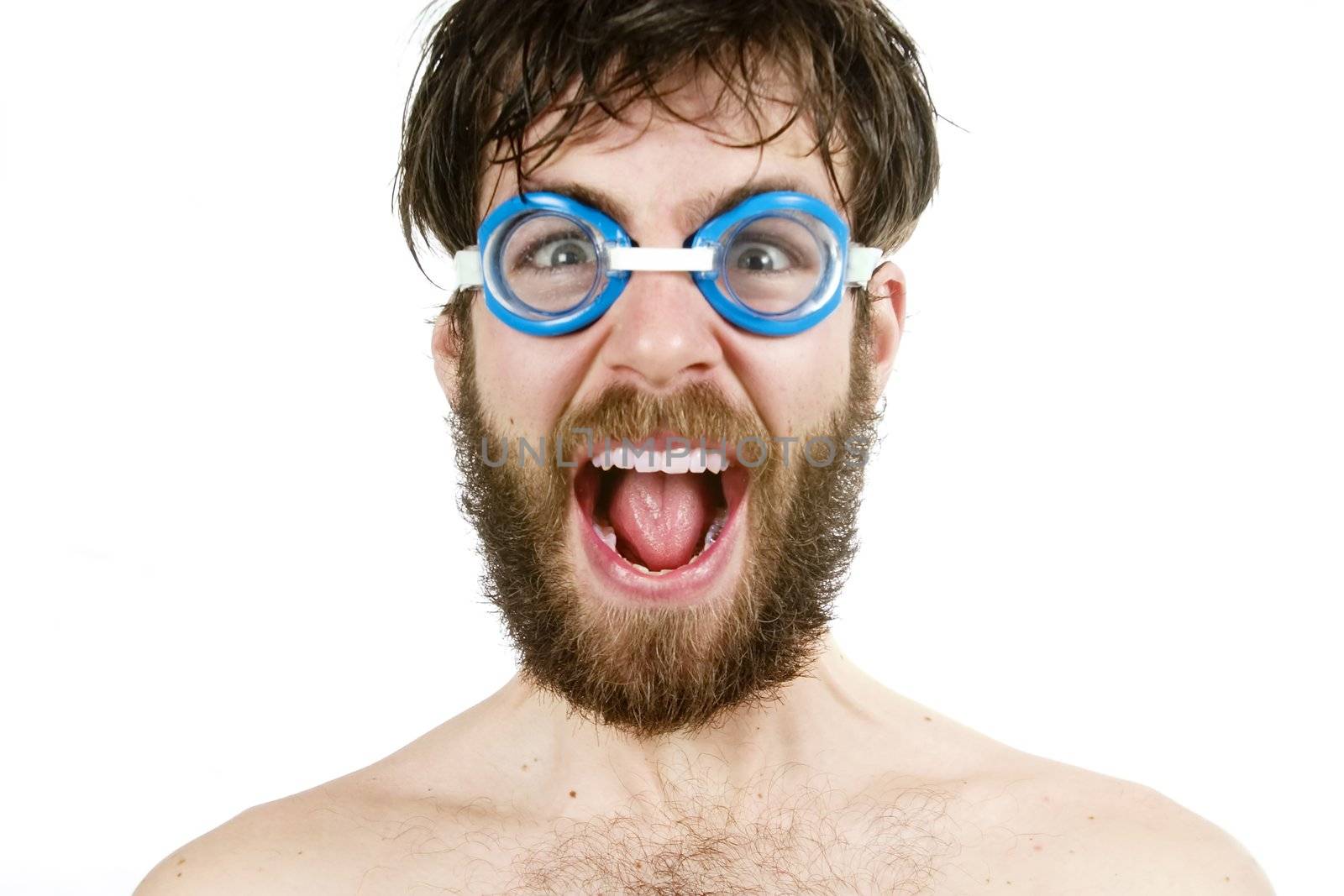 A humorous image of a young bearded male wearing swimming goggles, yelling.