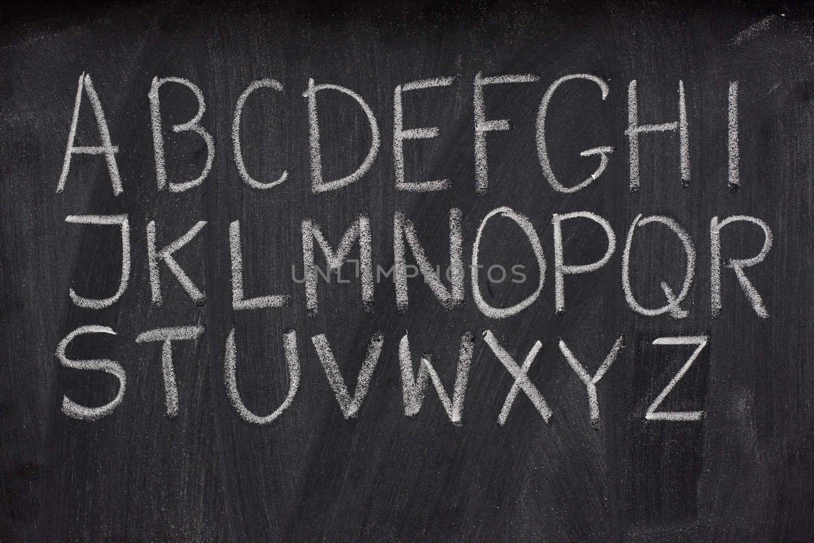 English alphabet on a blackboard by PixelsAway