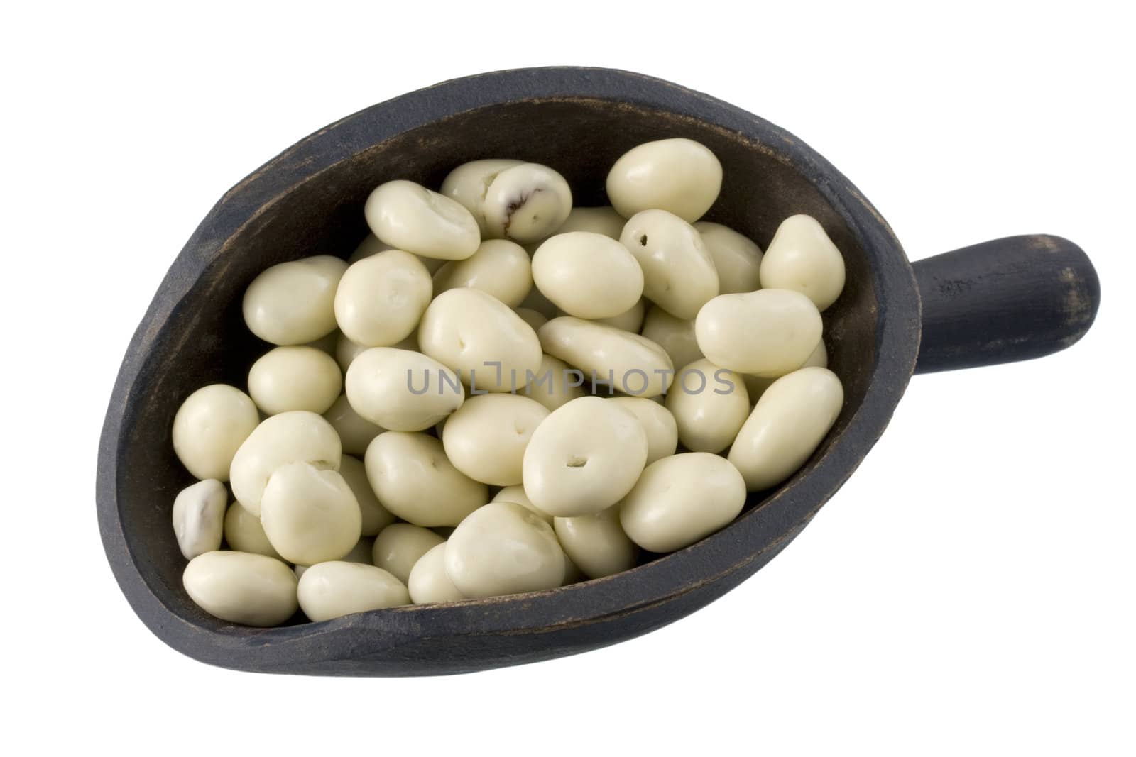 yogurt coated raisins on a primitive, wooden, dark painted, scoop, isolated with clipping path