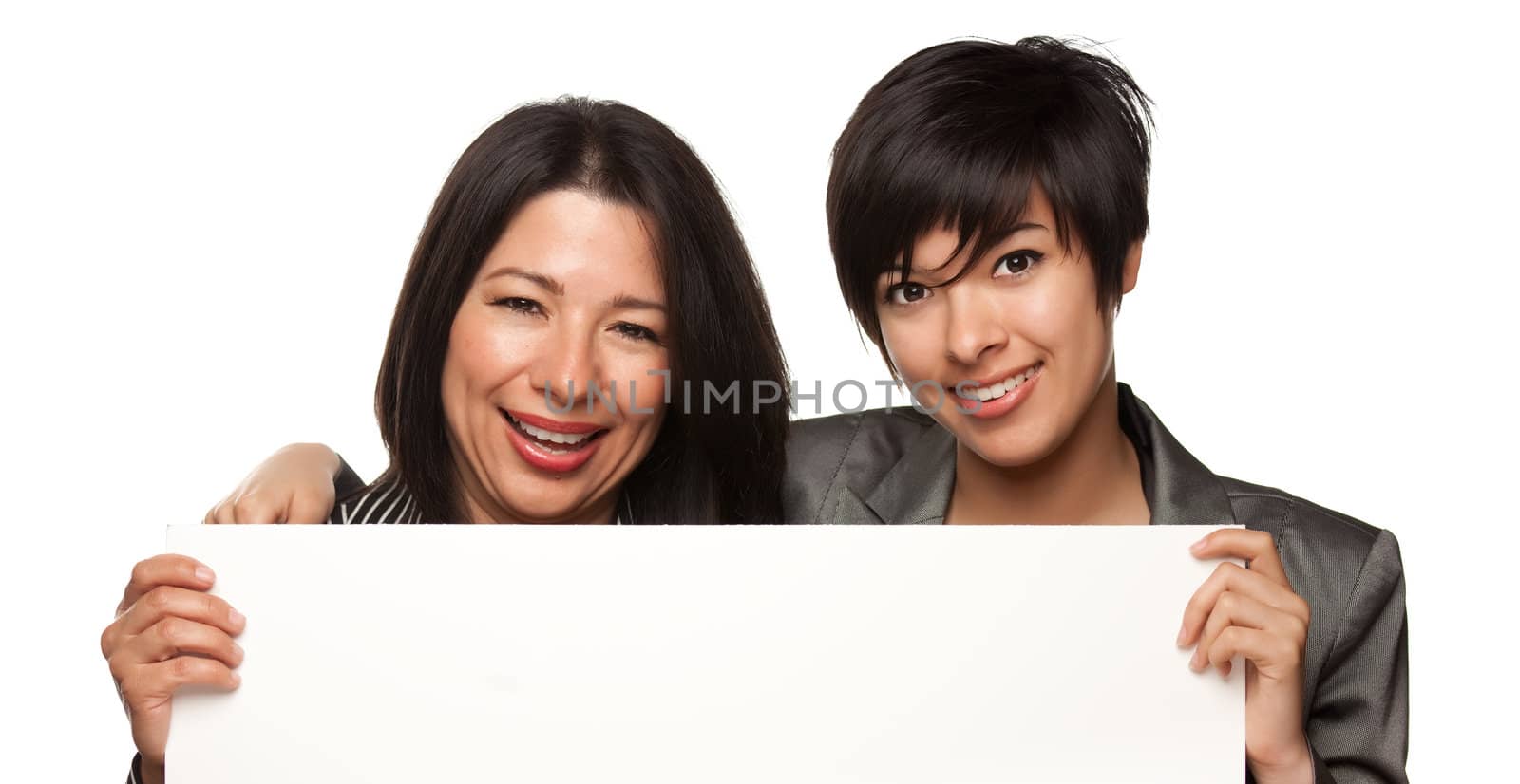 Attractive Multiethnic Mother and Daughter Holding Blank White Sign Isolated on a White Background.