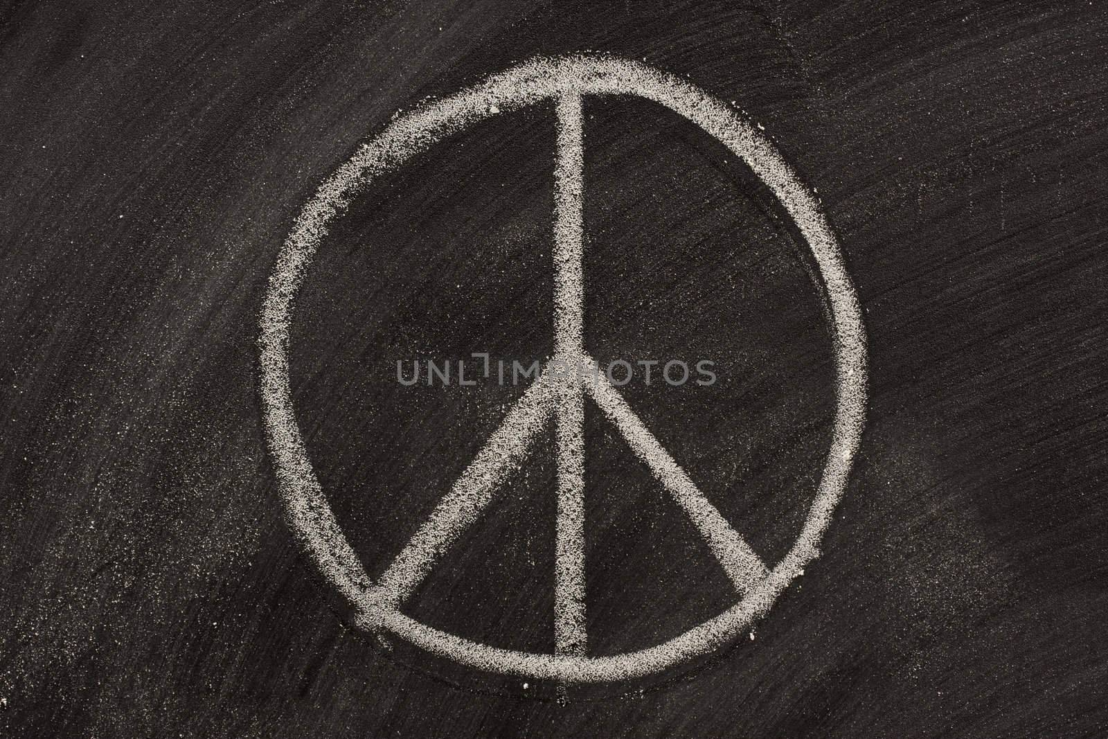 peace symbol on a blackboard by PixelsAway
