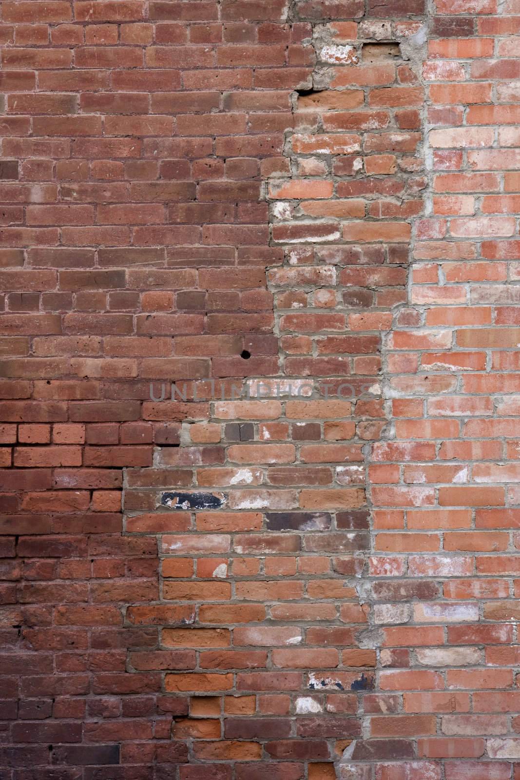 old brickwork with patches made with different bricks