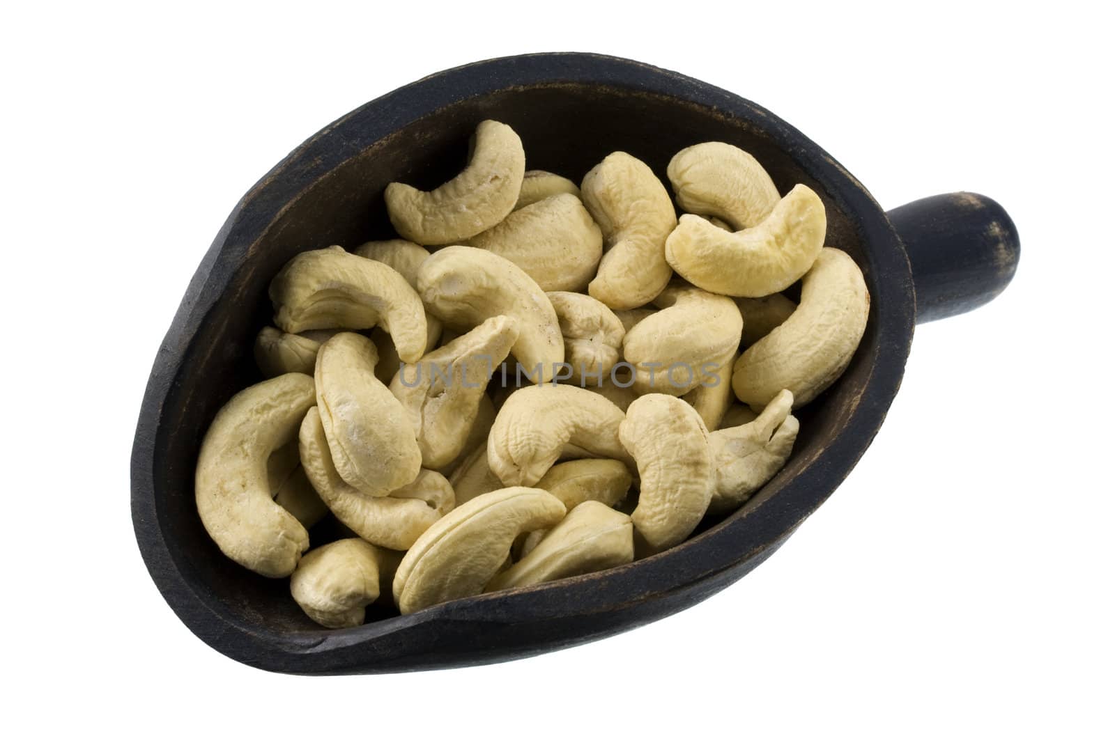 scoop of raw cashew nuts by PixelsAway