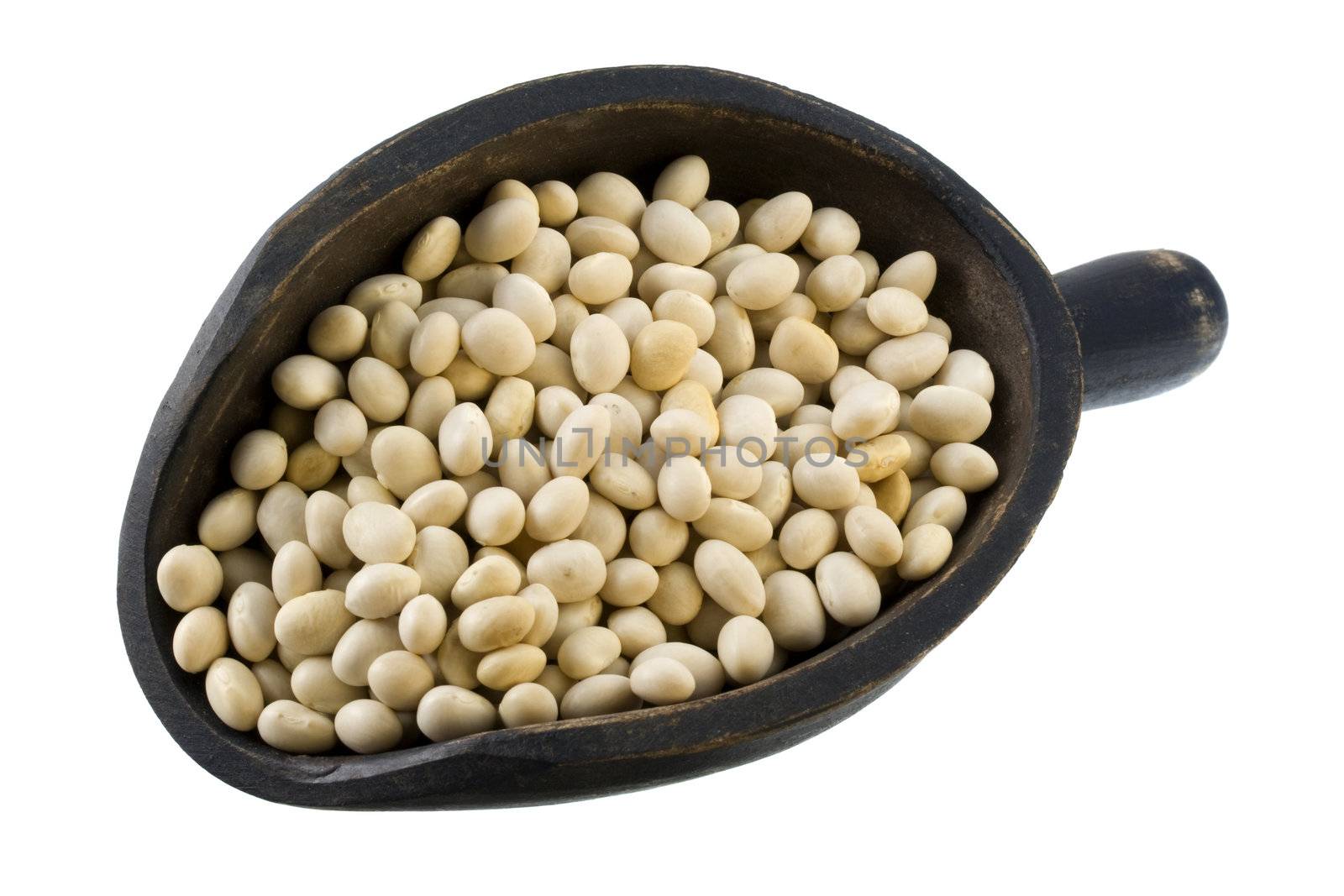 white navy beans on a primitive, wooden, dark painted scoop, isolated on white
