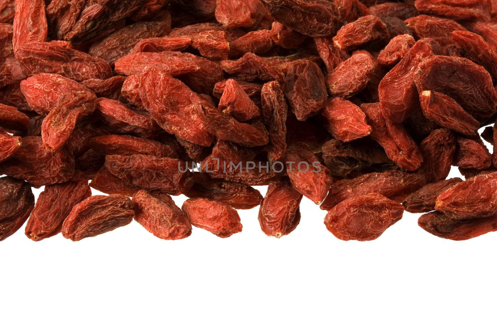 dried Tibetan goji berries as an upper frame on white background