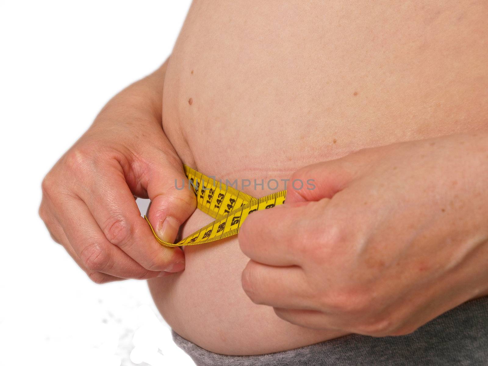 Overweight female. Waist circumference measured. White background by dotweb
