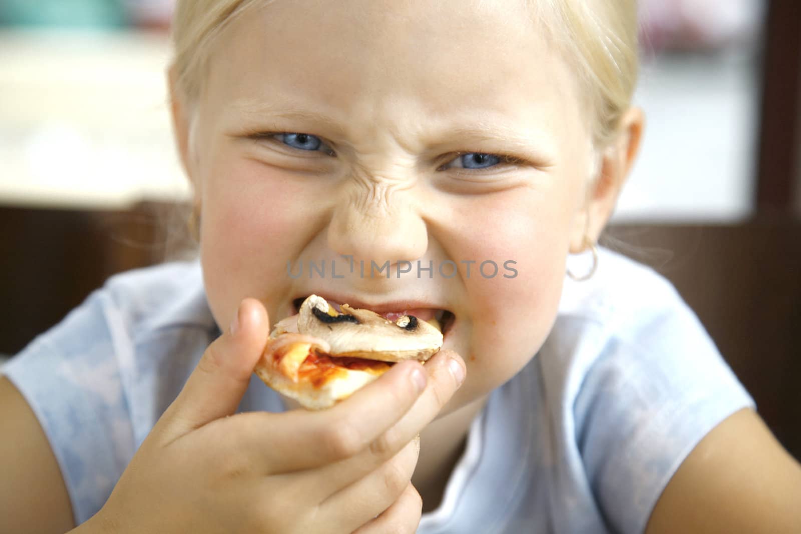 little girl with them pizza mushrooms