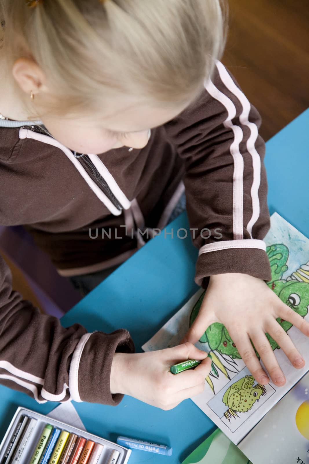 little girl paints  by Schonborn