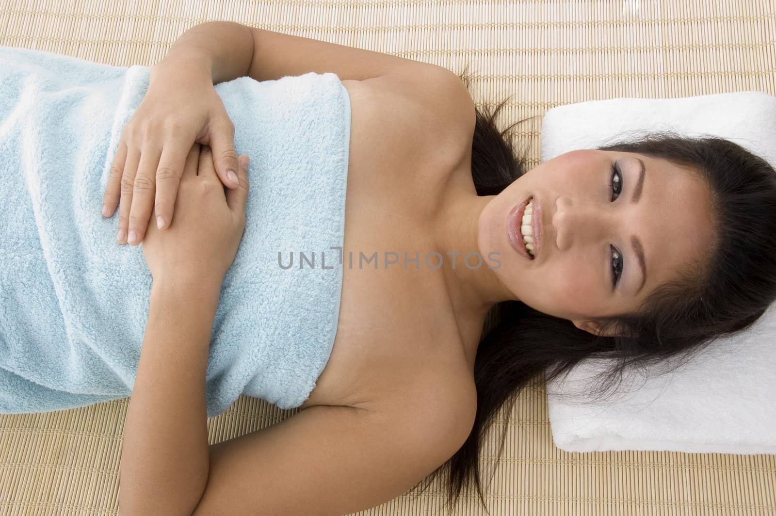 high angle view of smiling young woman going to take massage