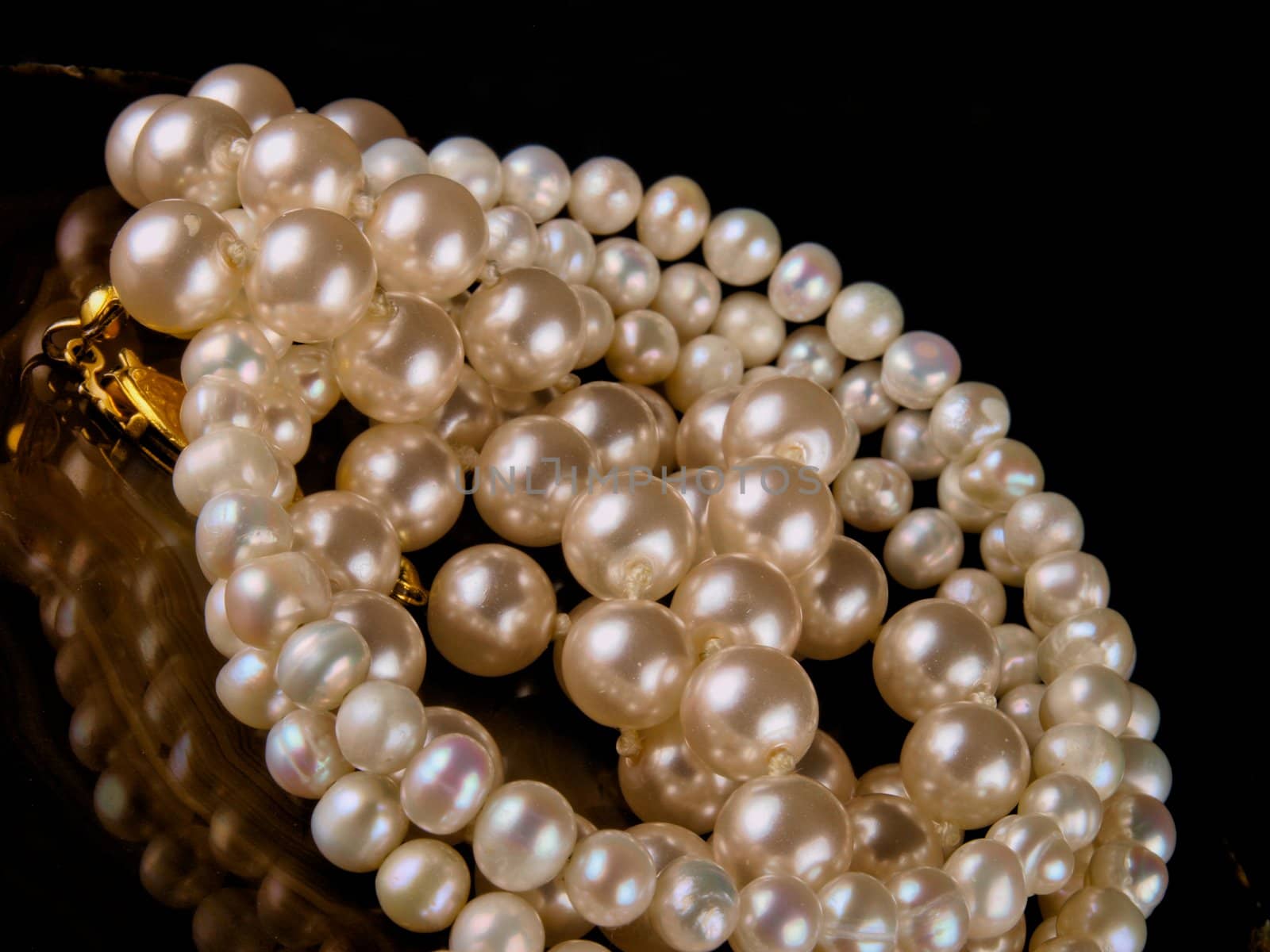 pearl bracelet close up on black background