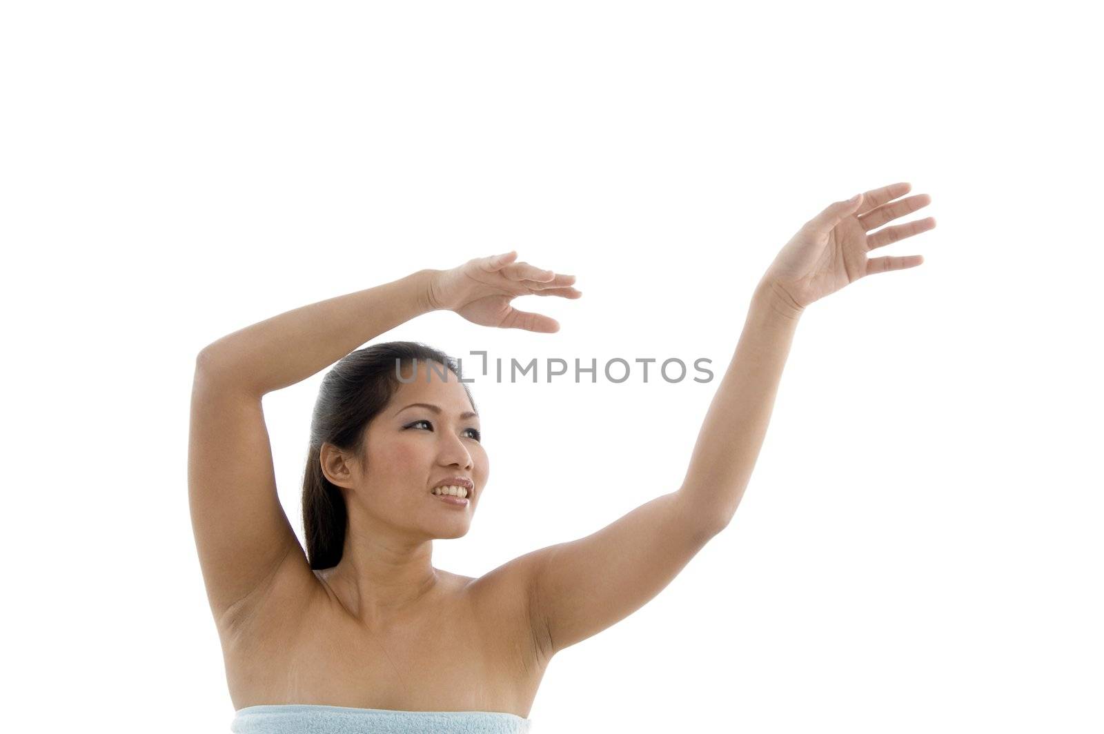 portrait of posing young woman against white background