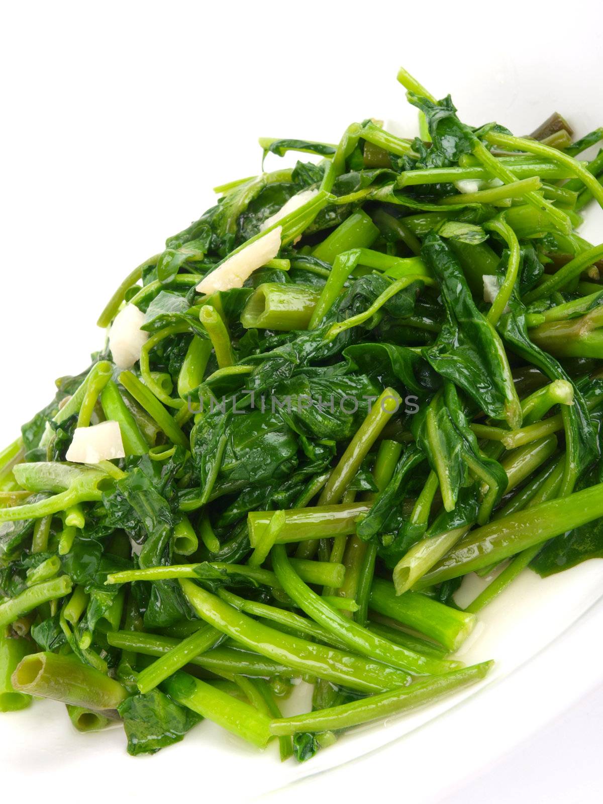 Fried spinach cabbage. Close up on white background by dotweb