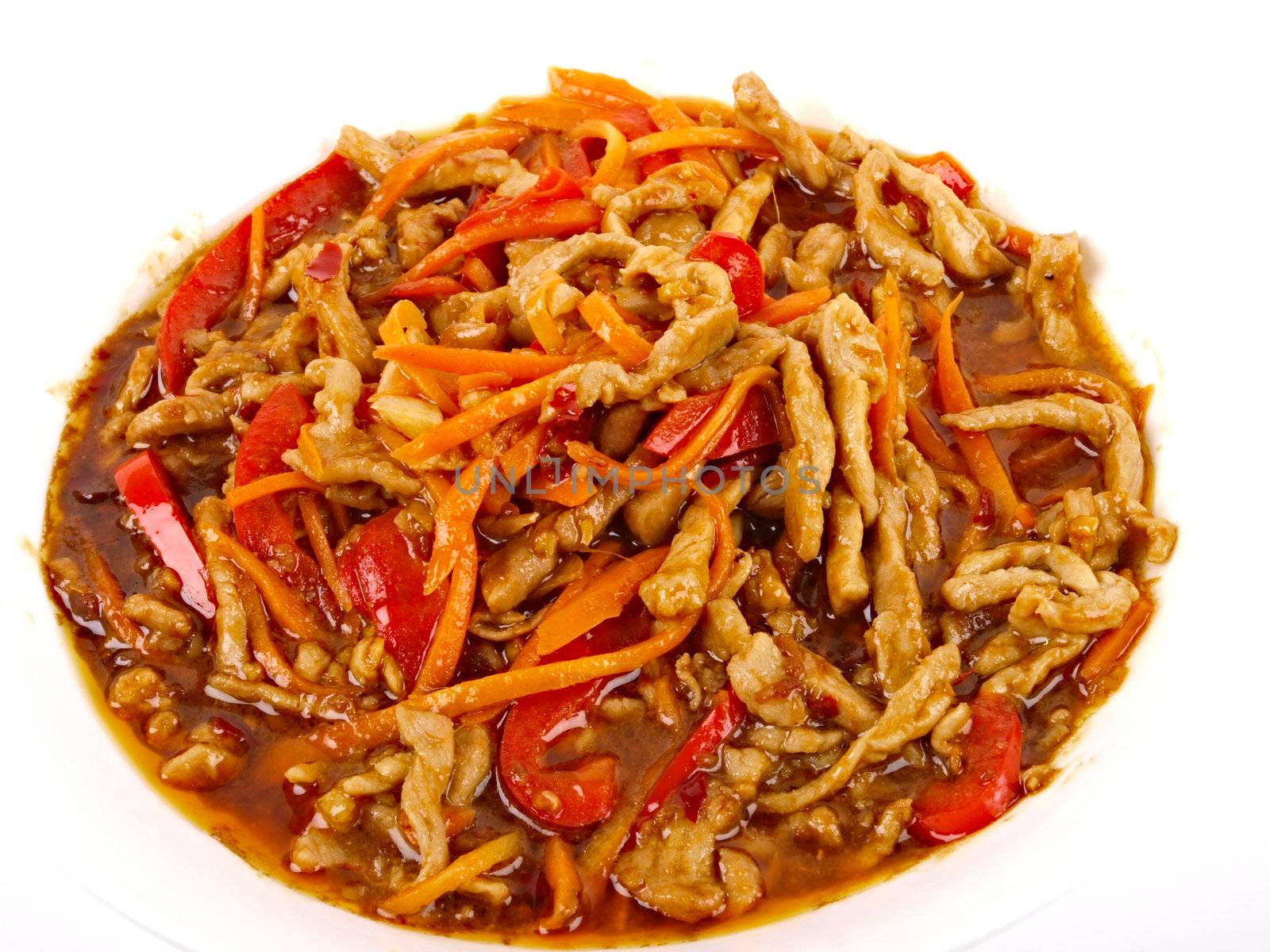 Chinese fried pork meat with pepper and carrot