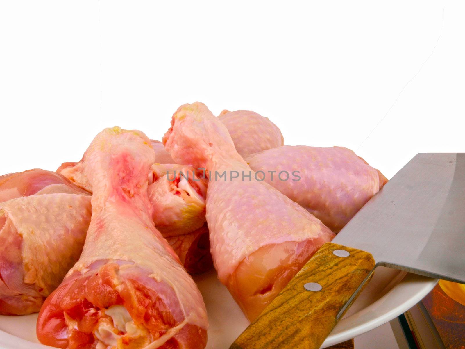 Fresh raw chicken legs. Close up on white background by dotweb