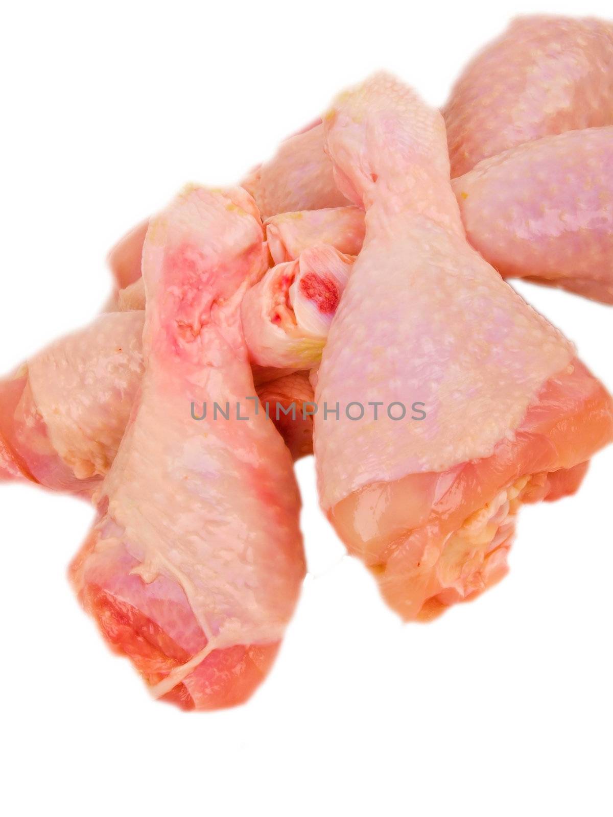 Fresh raw chicken legs. Close up on white background by dotweb