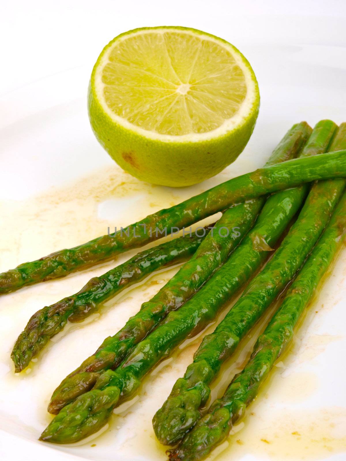 green asparagus. Close up. Lemon in background by dotweb