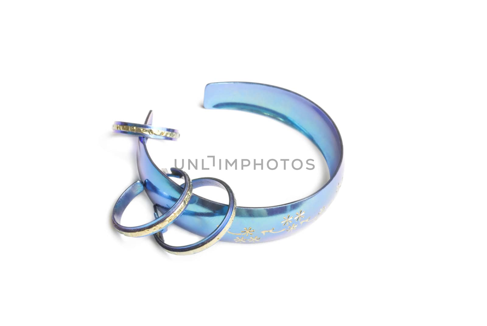 Blue bracelet, earrings and ring isolated on white