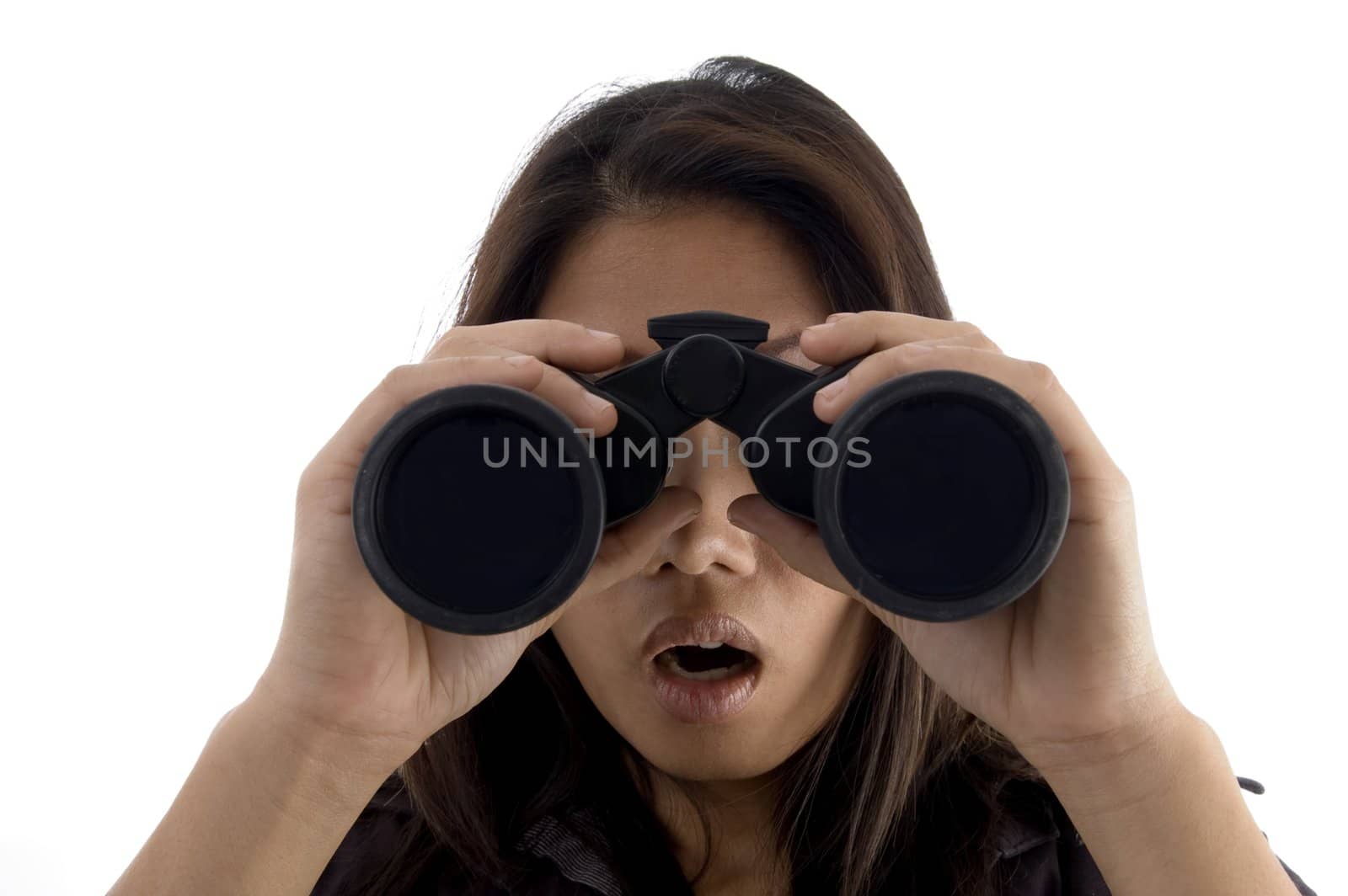 astonished female watching through binocular against white background
