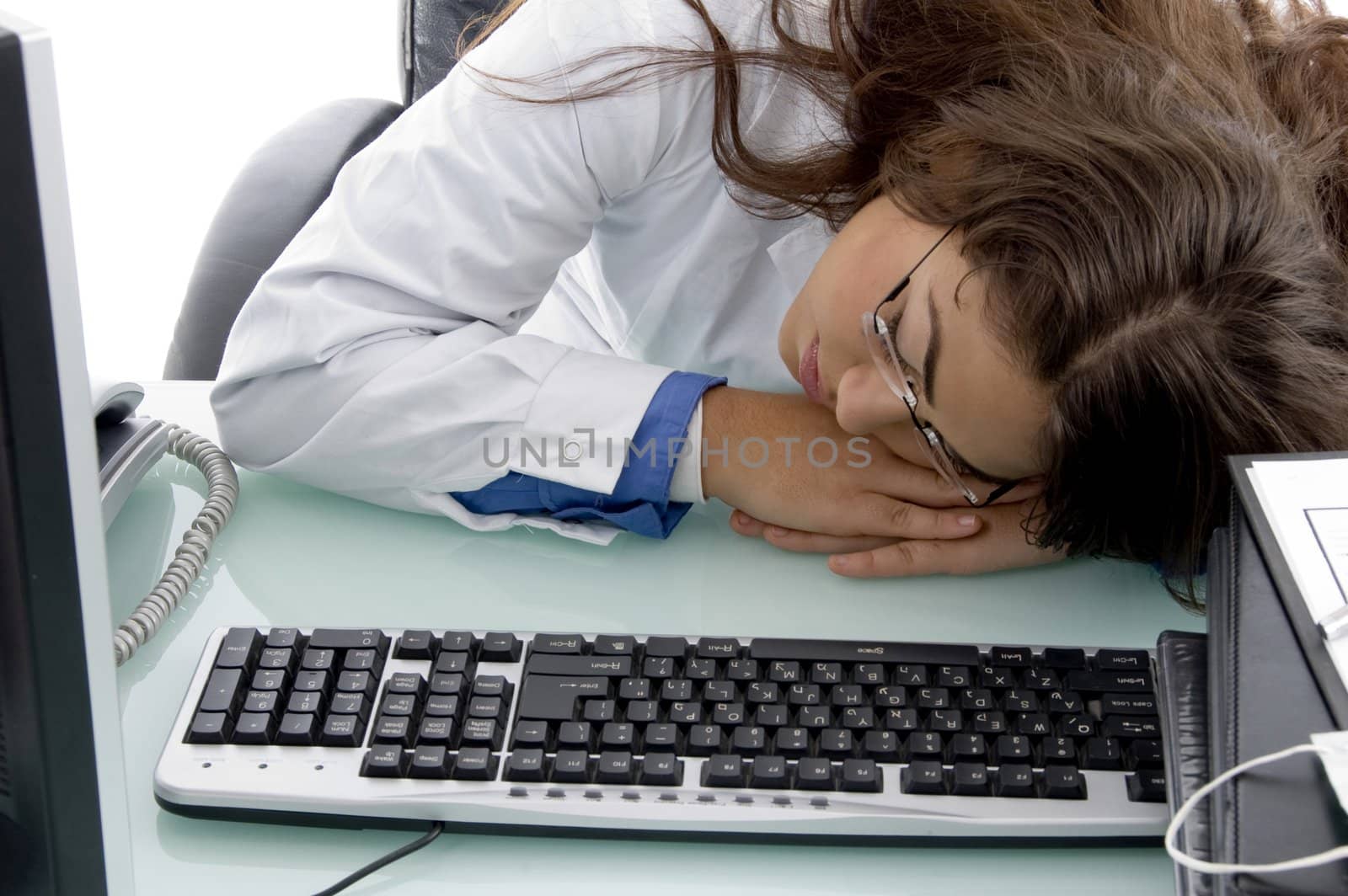 sleeping young doctor on an isolated background