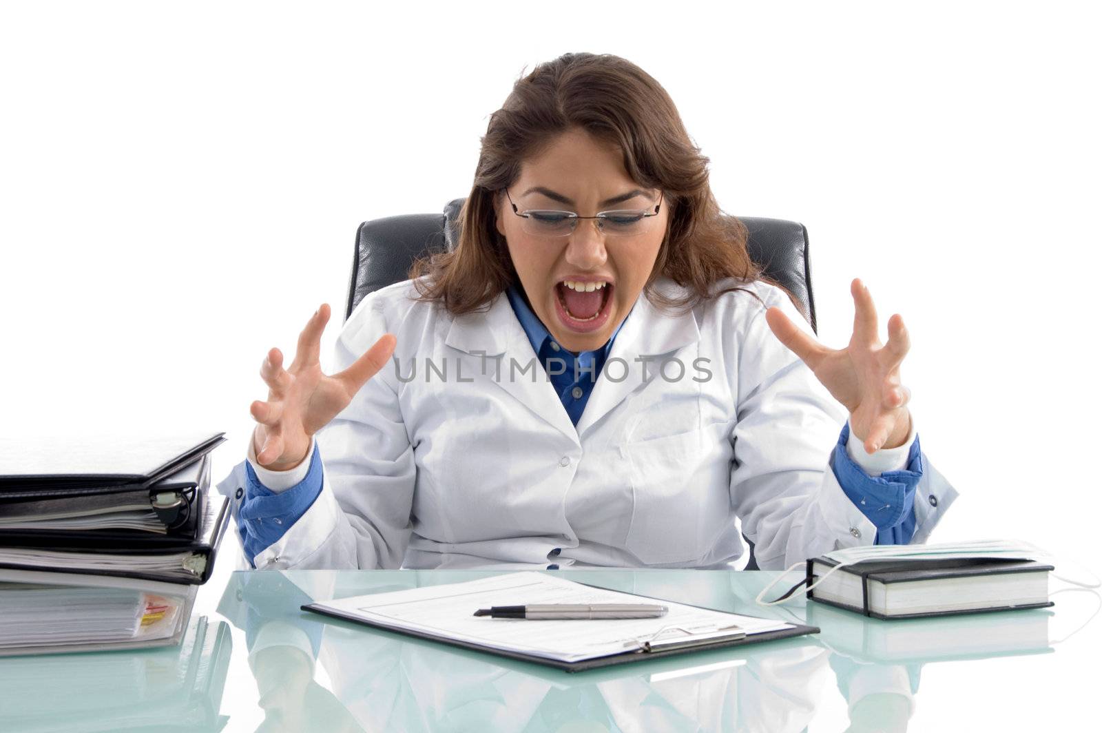 frustrated doctor in workplace by imagerymajestic