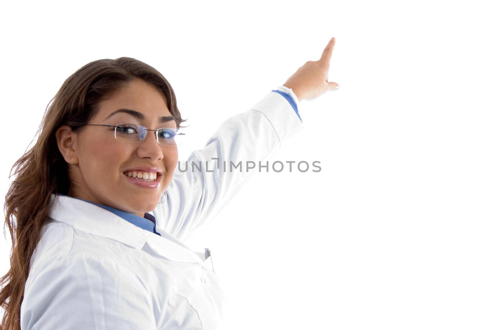 smiling female pointing with finger on an isolated white background