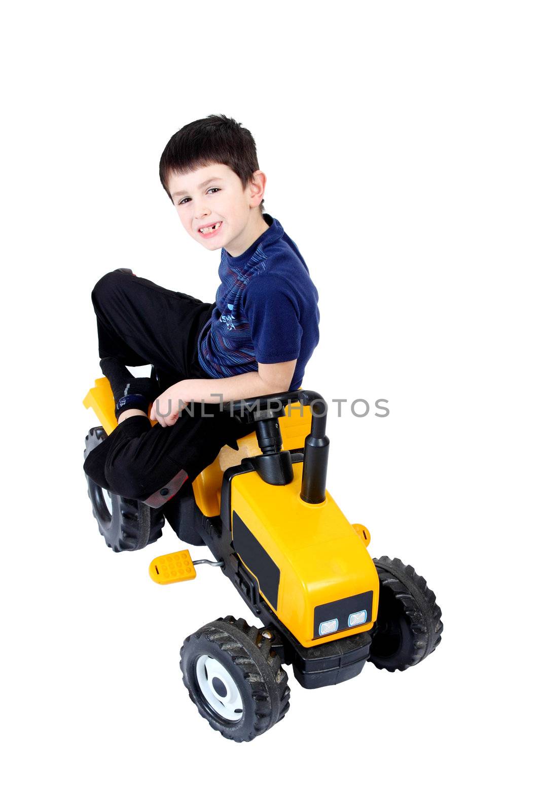 small boy on the yellow tractor by artush
