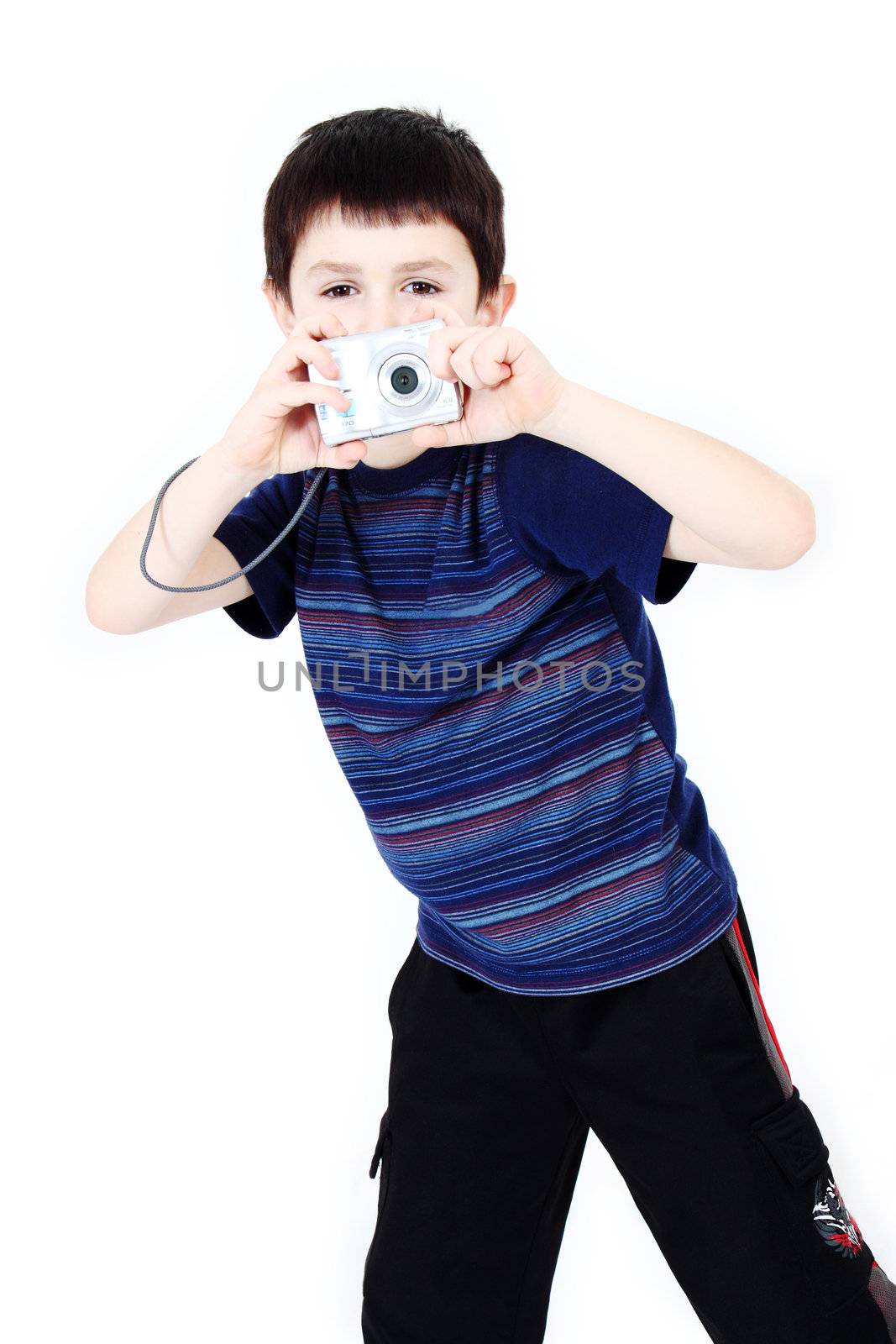 Young boy with digital camera prepare for shooting