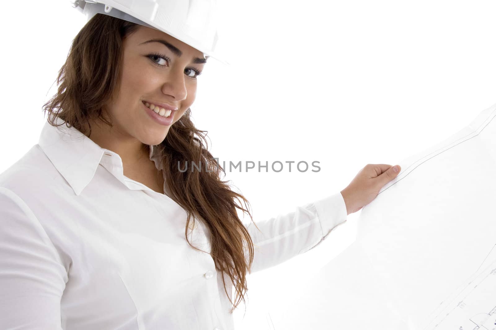 young female architect holding open blue prints against white background