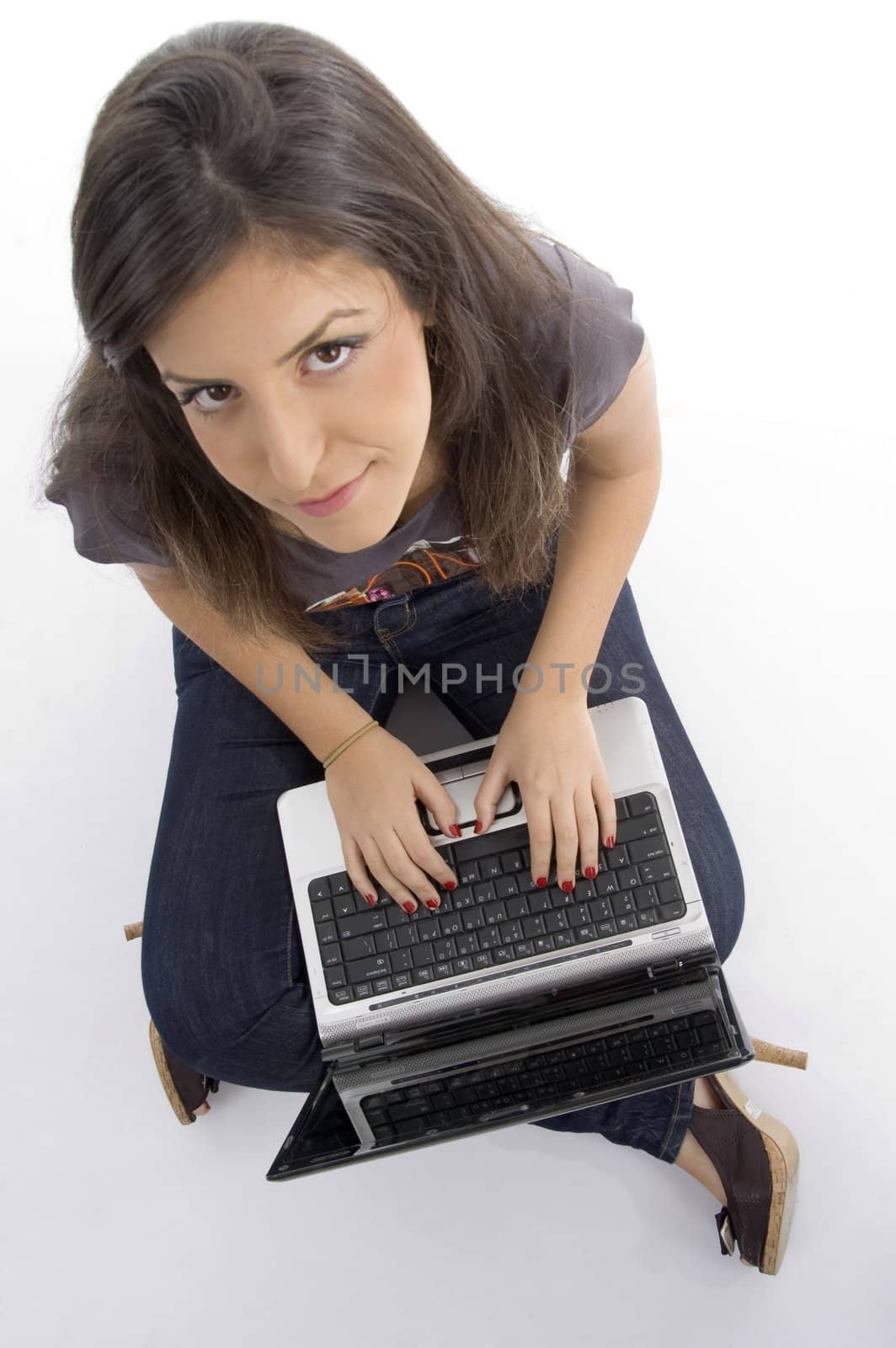 pretty woman working on laptop on an isolated white background