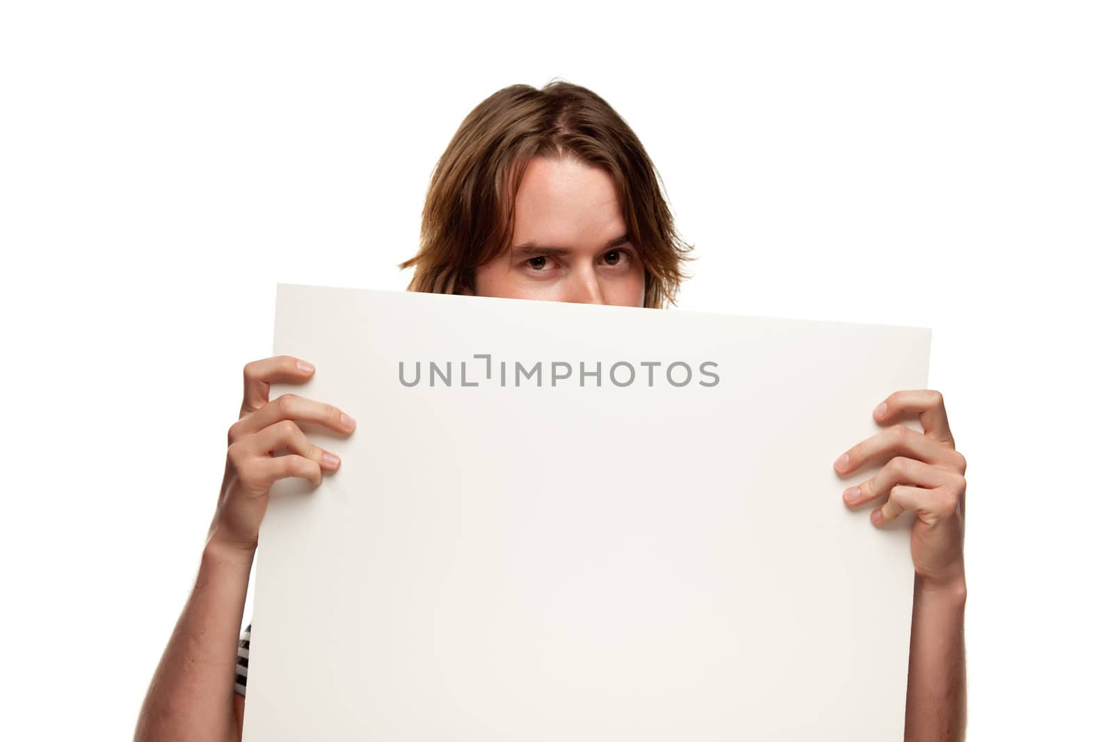 Fun Young Man Holding Blank White Sign Isolated on a White Background.