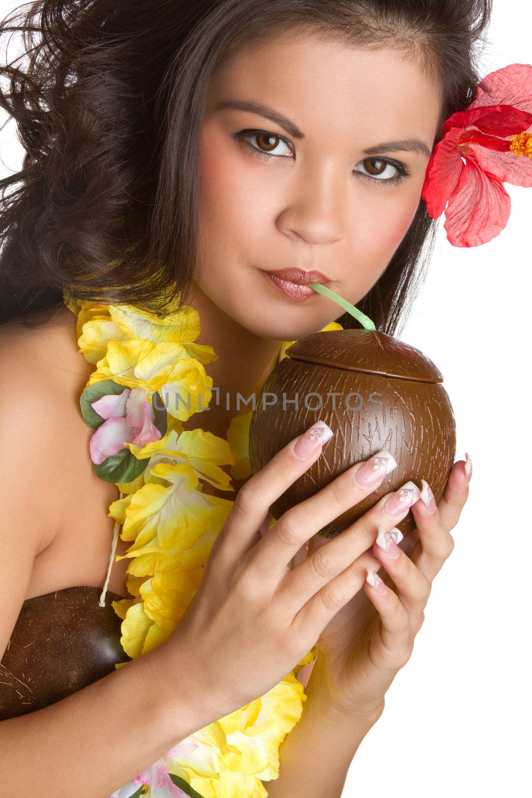 Tropical woman drinking from coconut