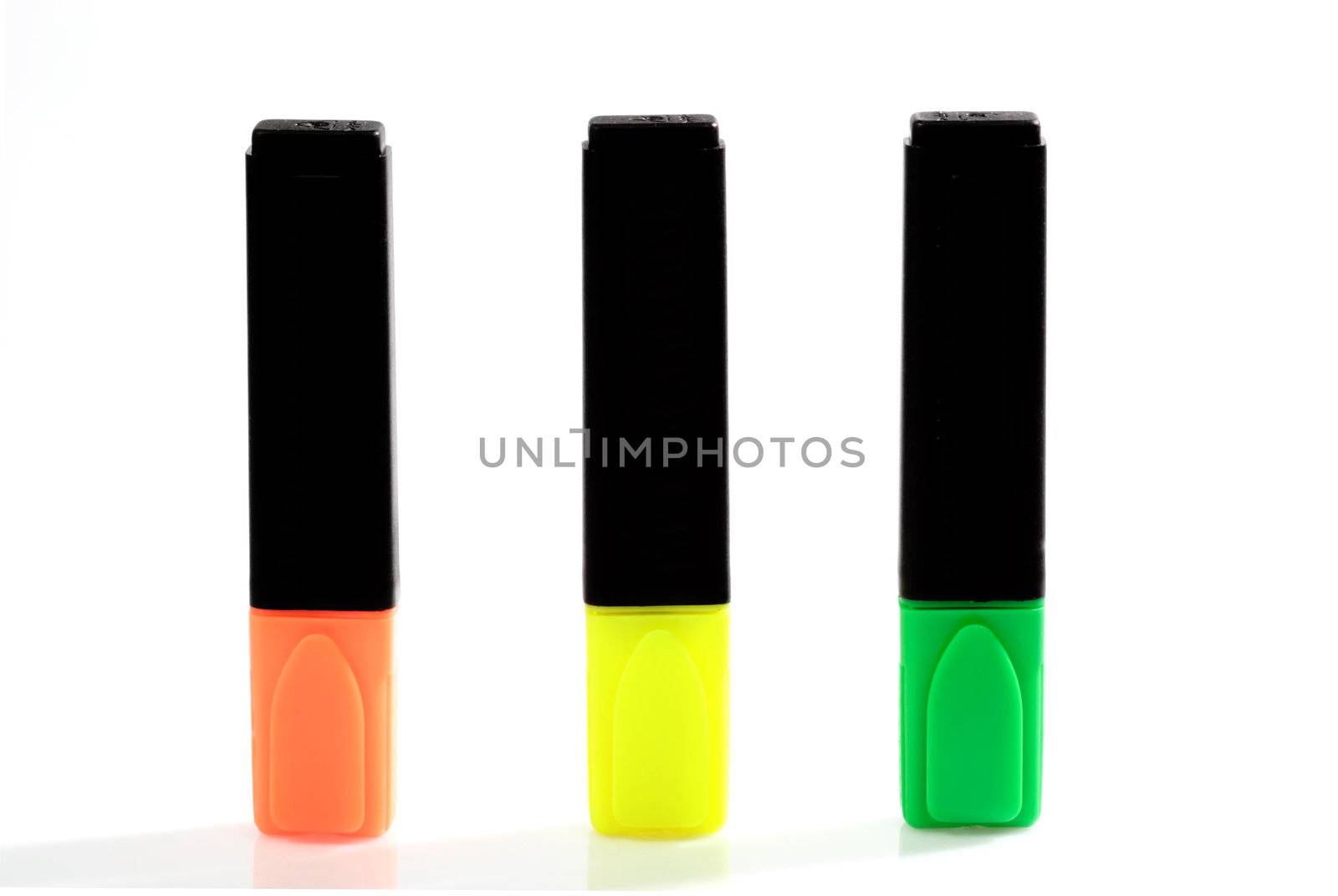 Yellow, green and orange highlighter on bright background