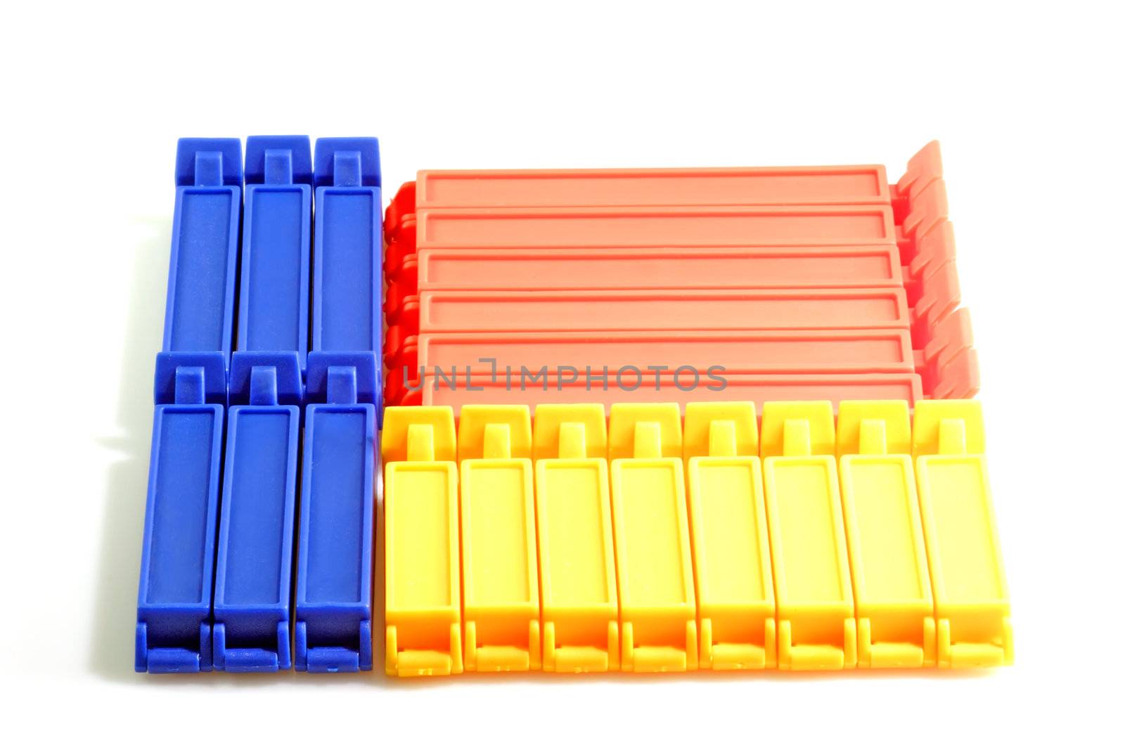Red blue and yellow kitchen clips on bright background