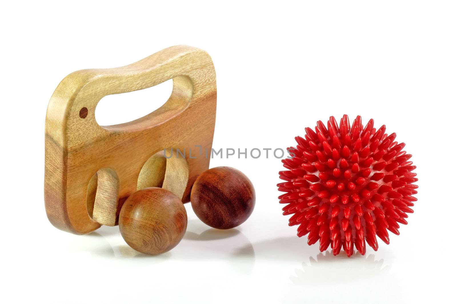 Massage ball and massage roller on white background