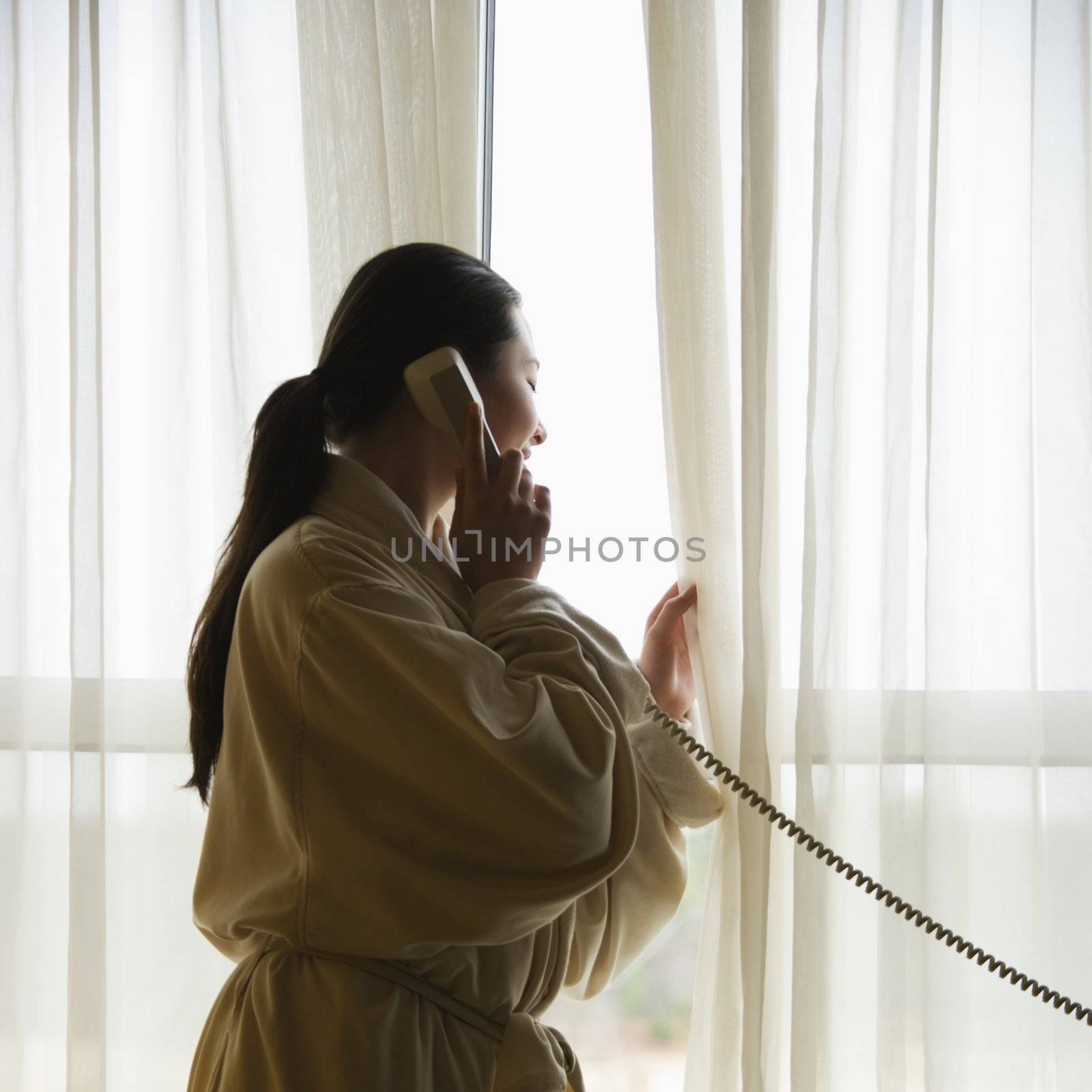 Woman on telephone. by iofoto