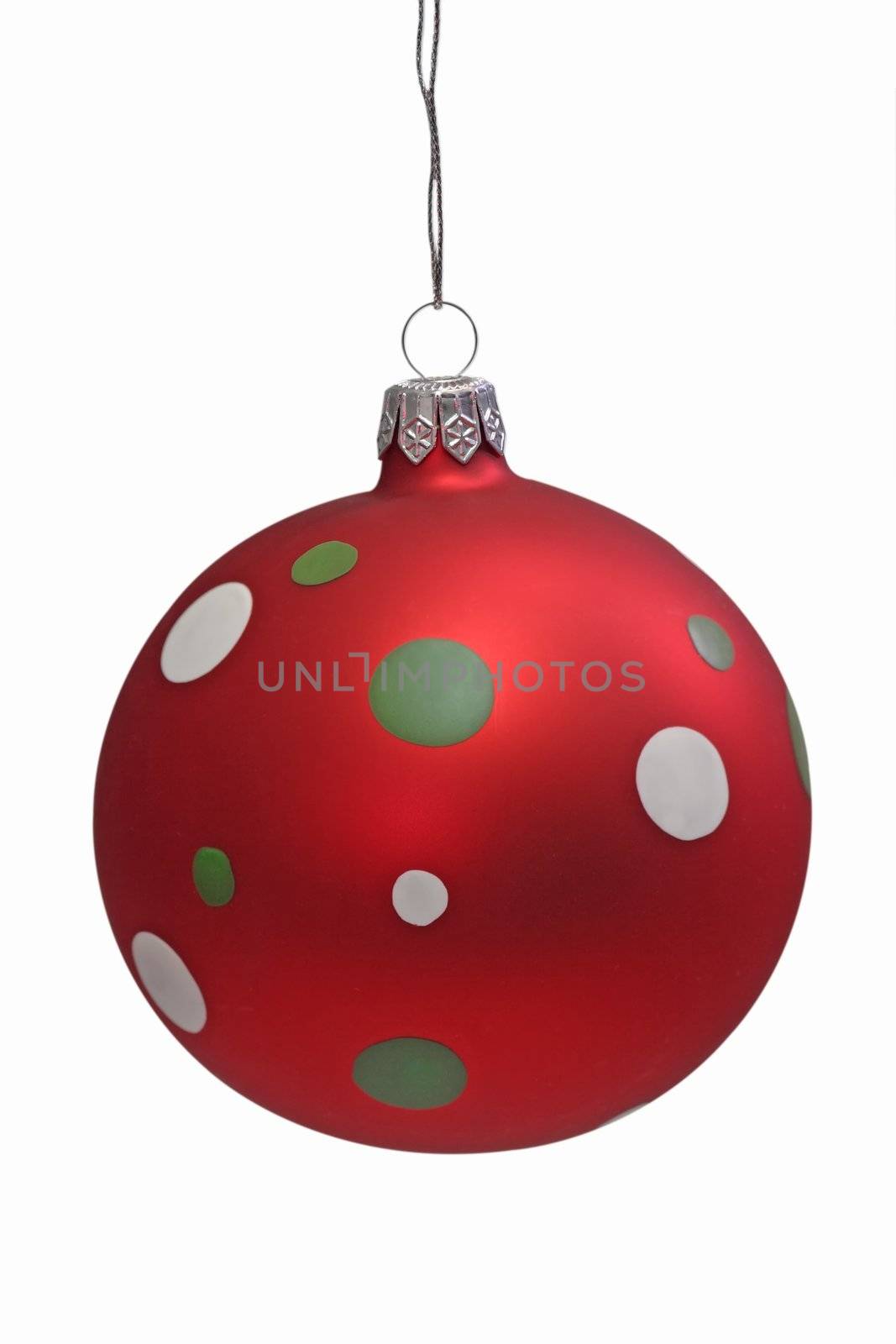 Red christmas tree ball with spots, isolated on white background