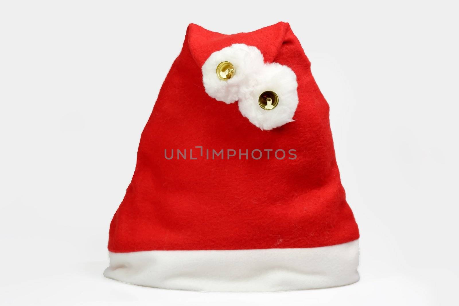 Red and white santa hat on light background