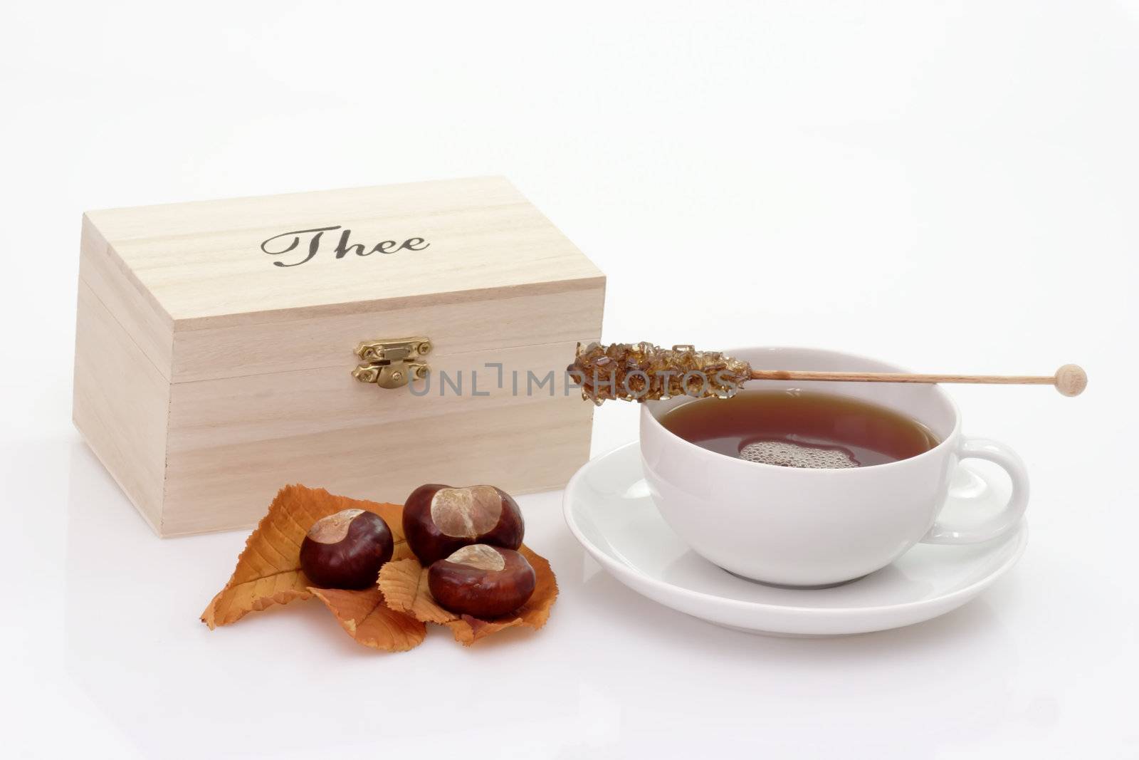 A Cup of tea and a wooden box with on bright background